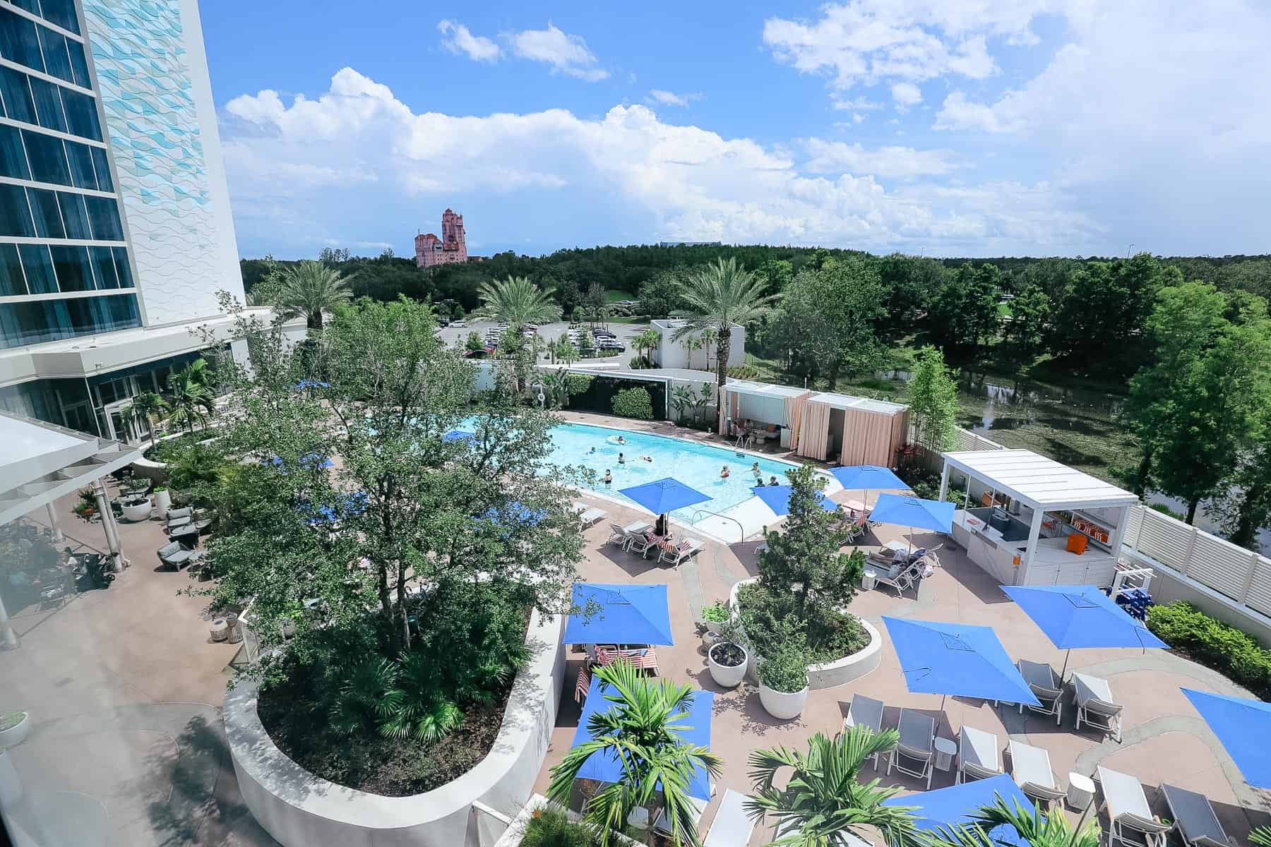 a pool and Disney view of Hollywood Studios from the Swan Reserve Hotel 