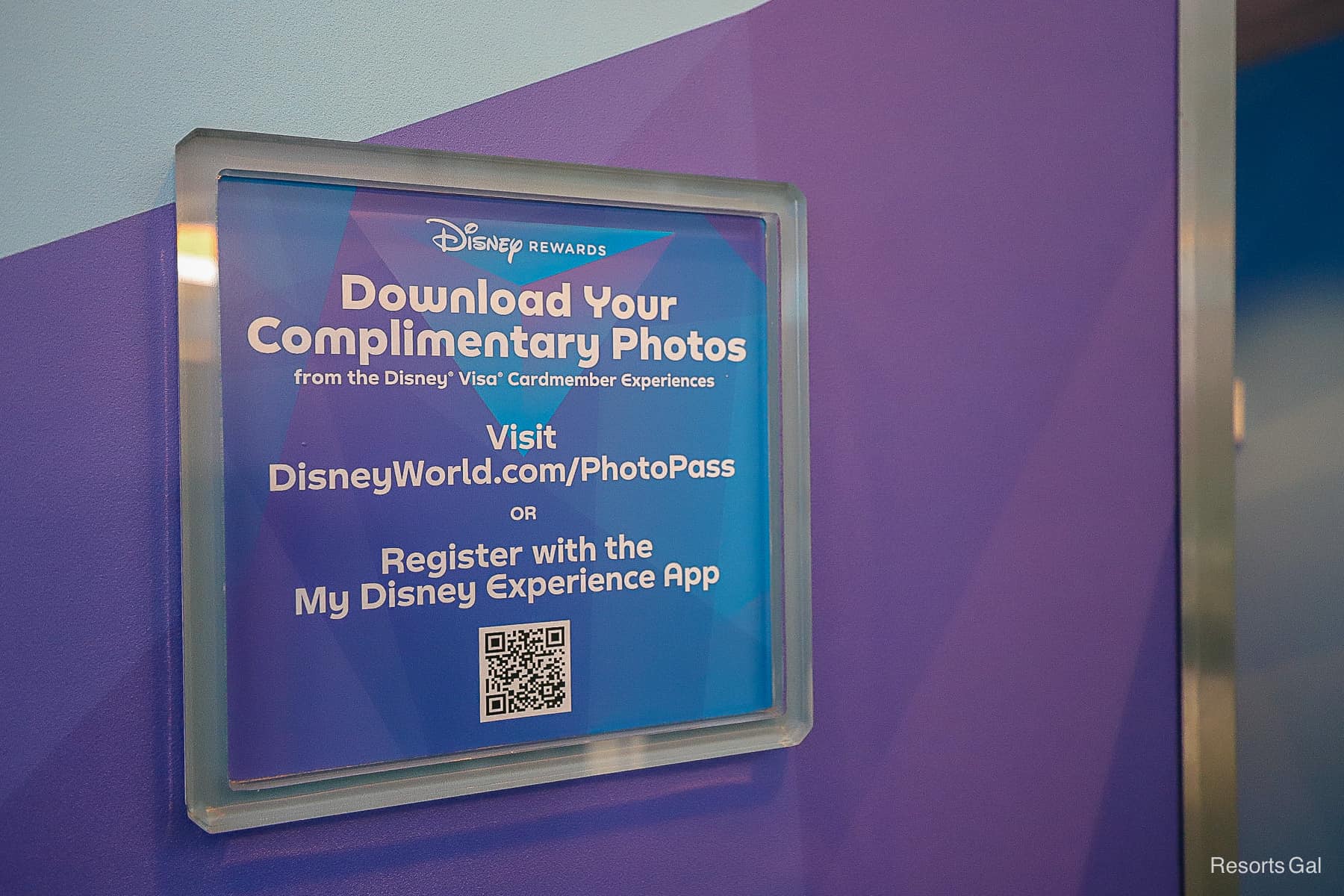 a sign with a QR code to download your complimentary photos
