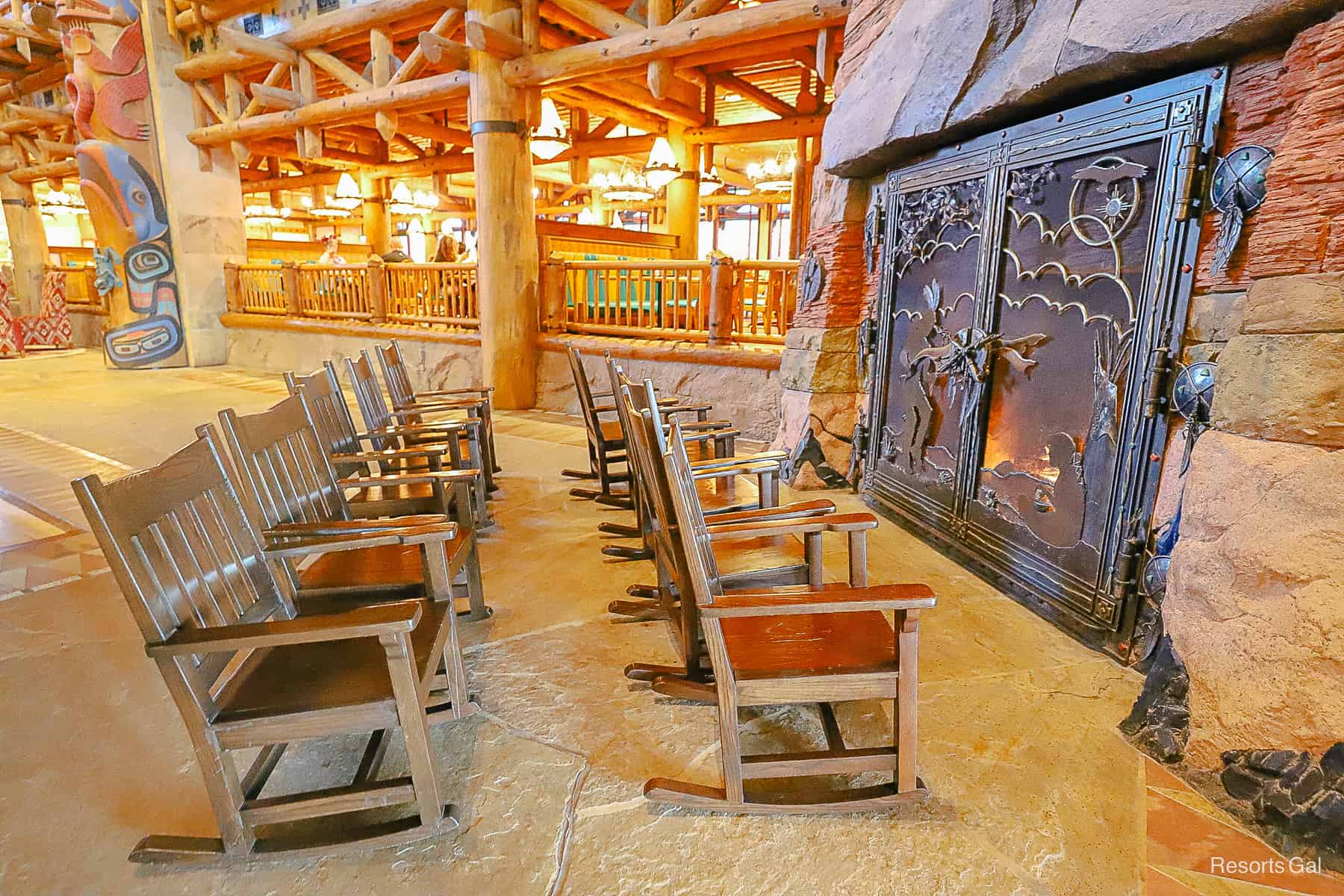 rocking chairs sitting in front of the fire at Disney's Wilderness Lodge 