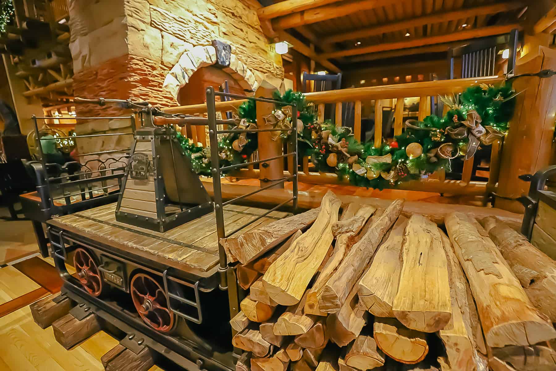 a stack of wood for the fireplace accented with holiday decor 