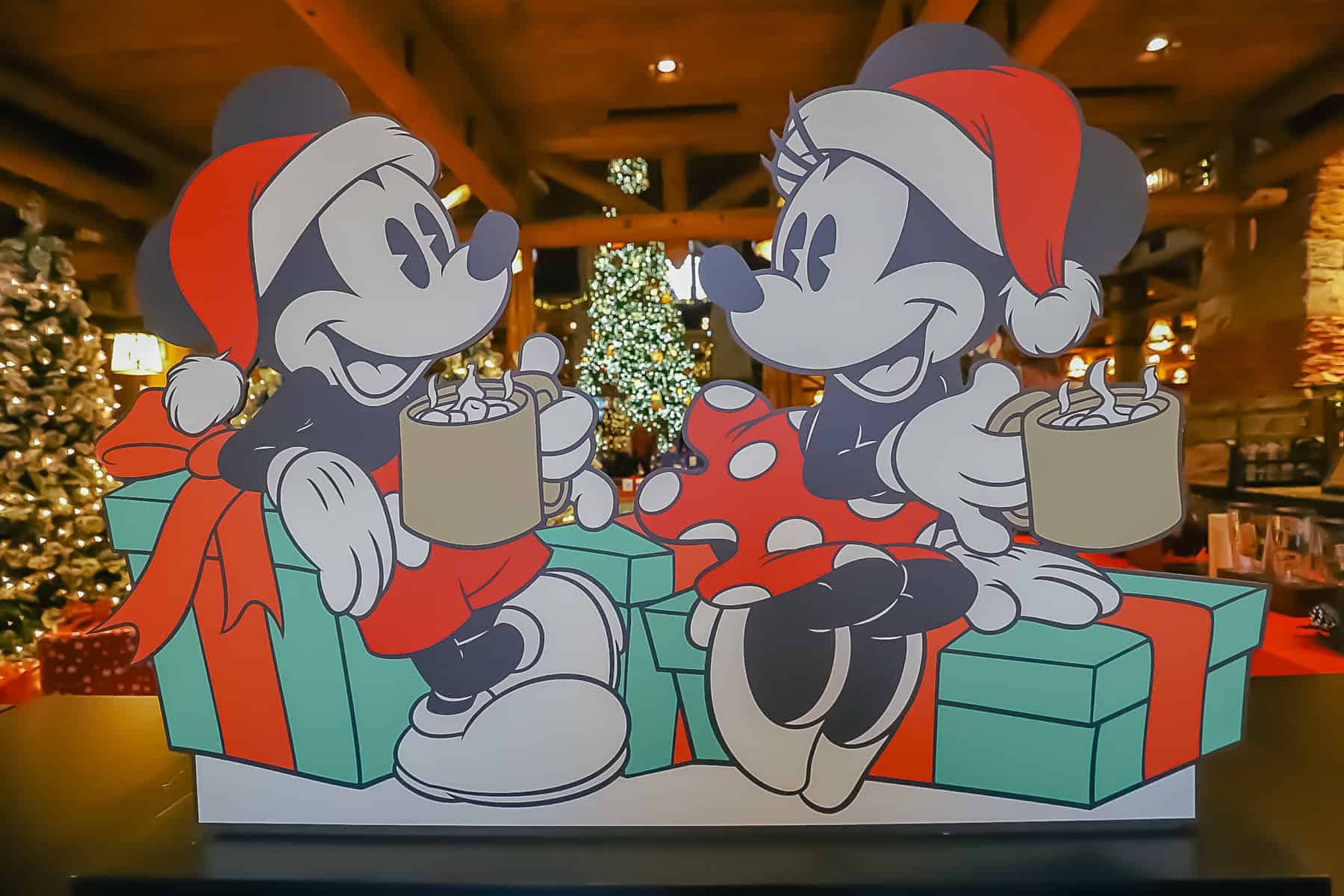 Cardboard cutout of Mickey and Minnie Mouse drinking hot chocolate 