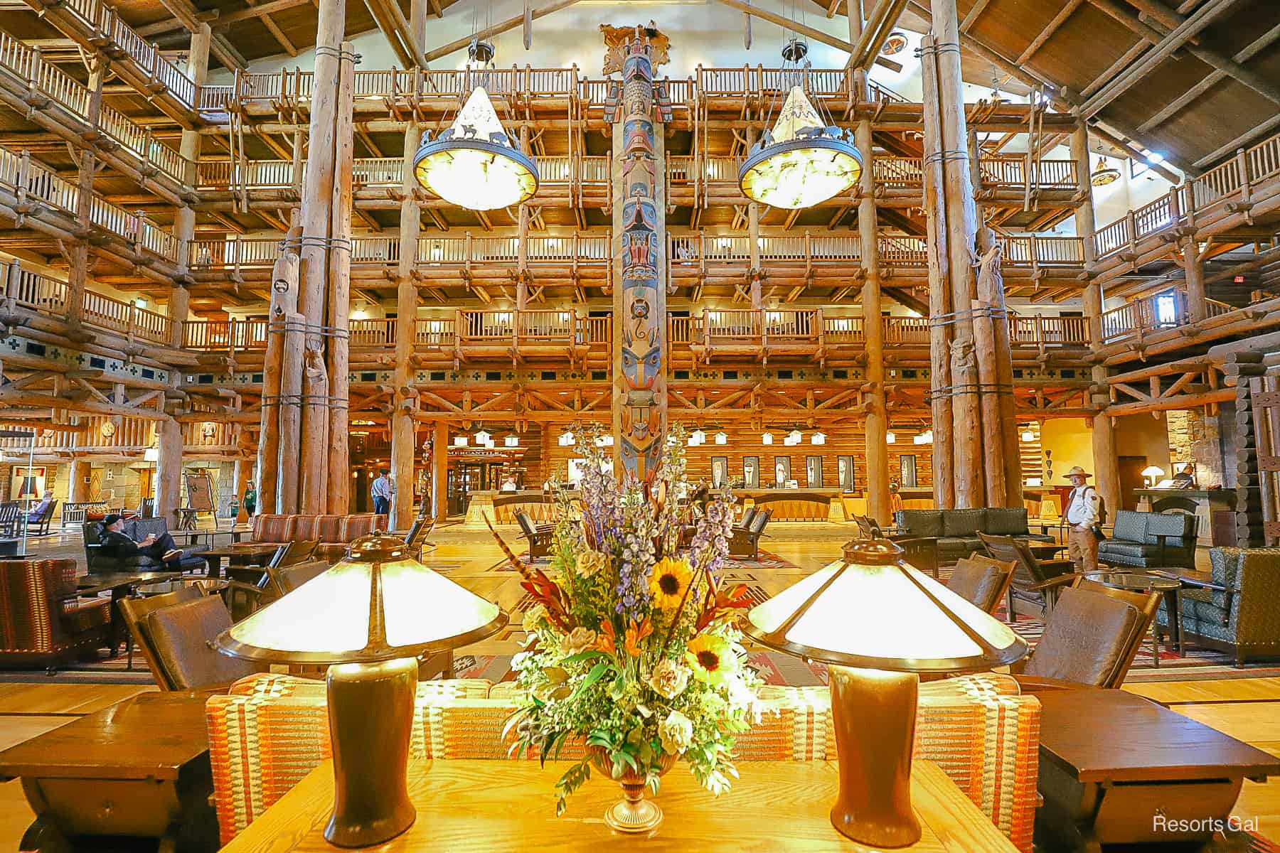 a scenic view of the Wilderness Lodge Lobby with a wildflower bouquet between them 