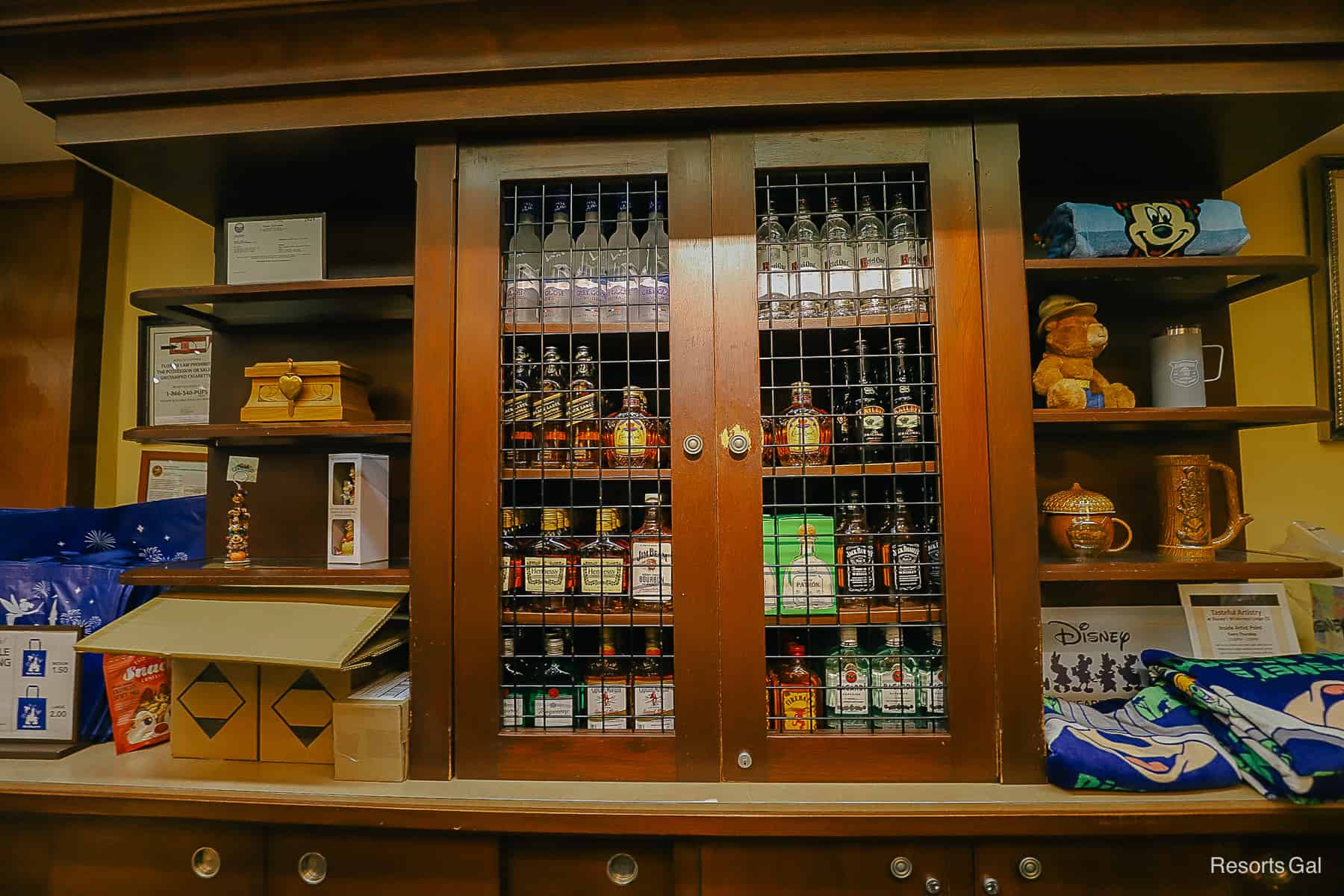 a display case with liquors behind the register 