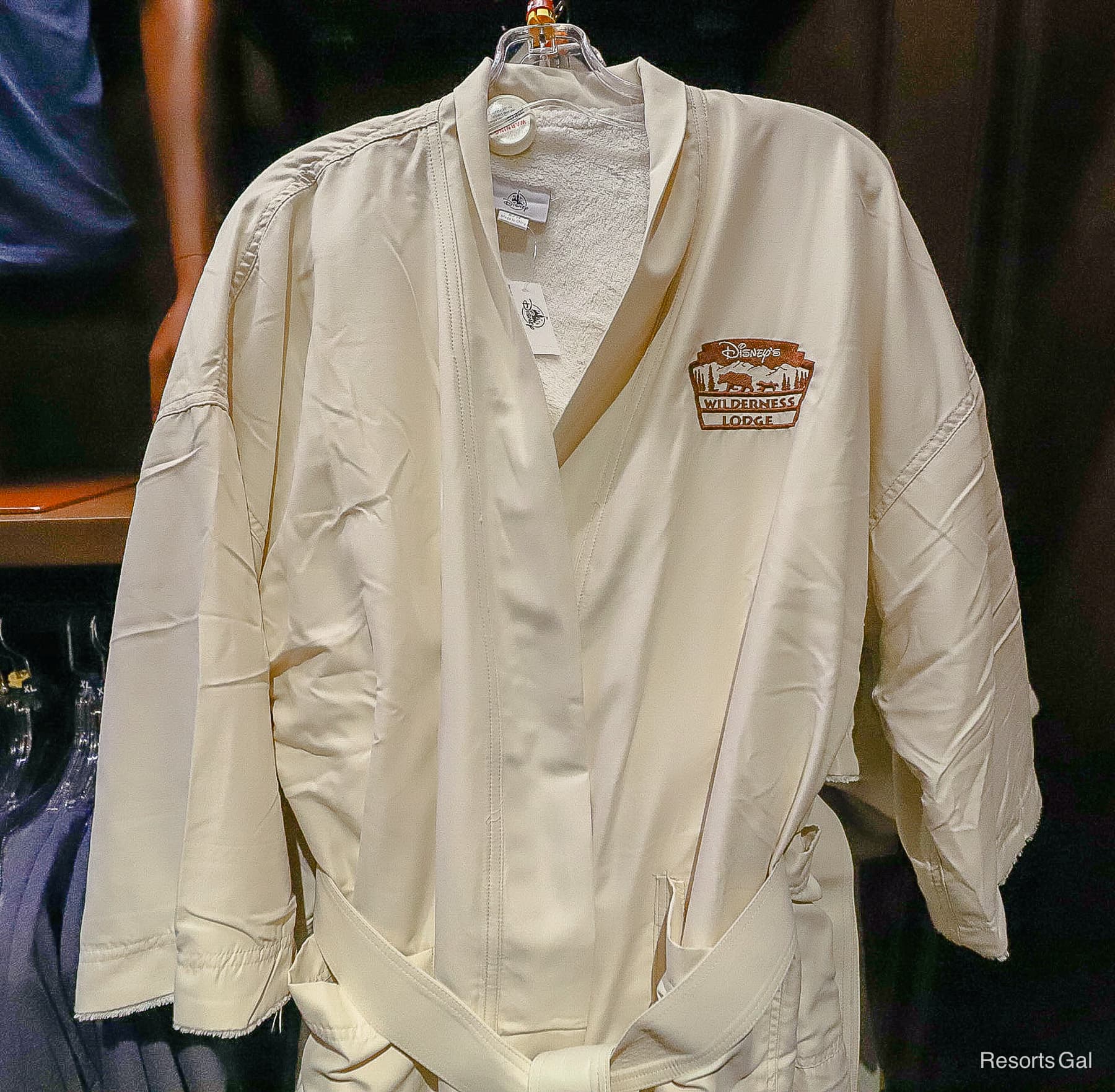 resort robe in a cream color with the Wilderness Lodge logo in brown 