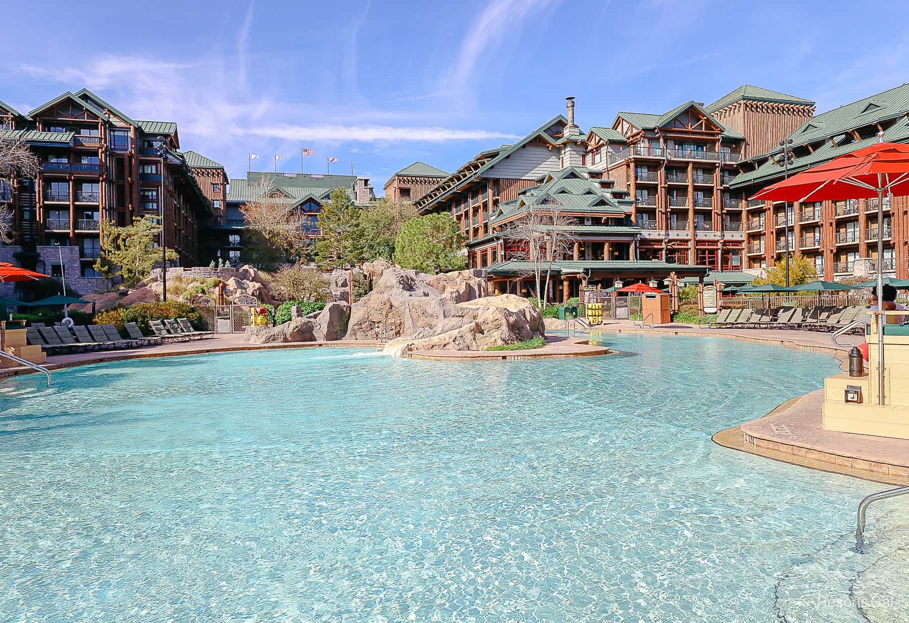 the feature pool with blue waters and the Wilderness Lodge as a backdrop 