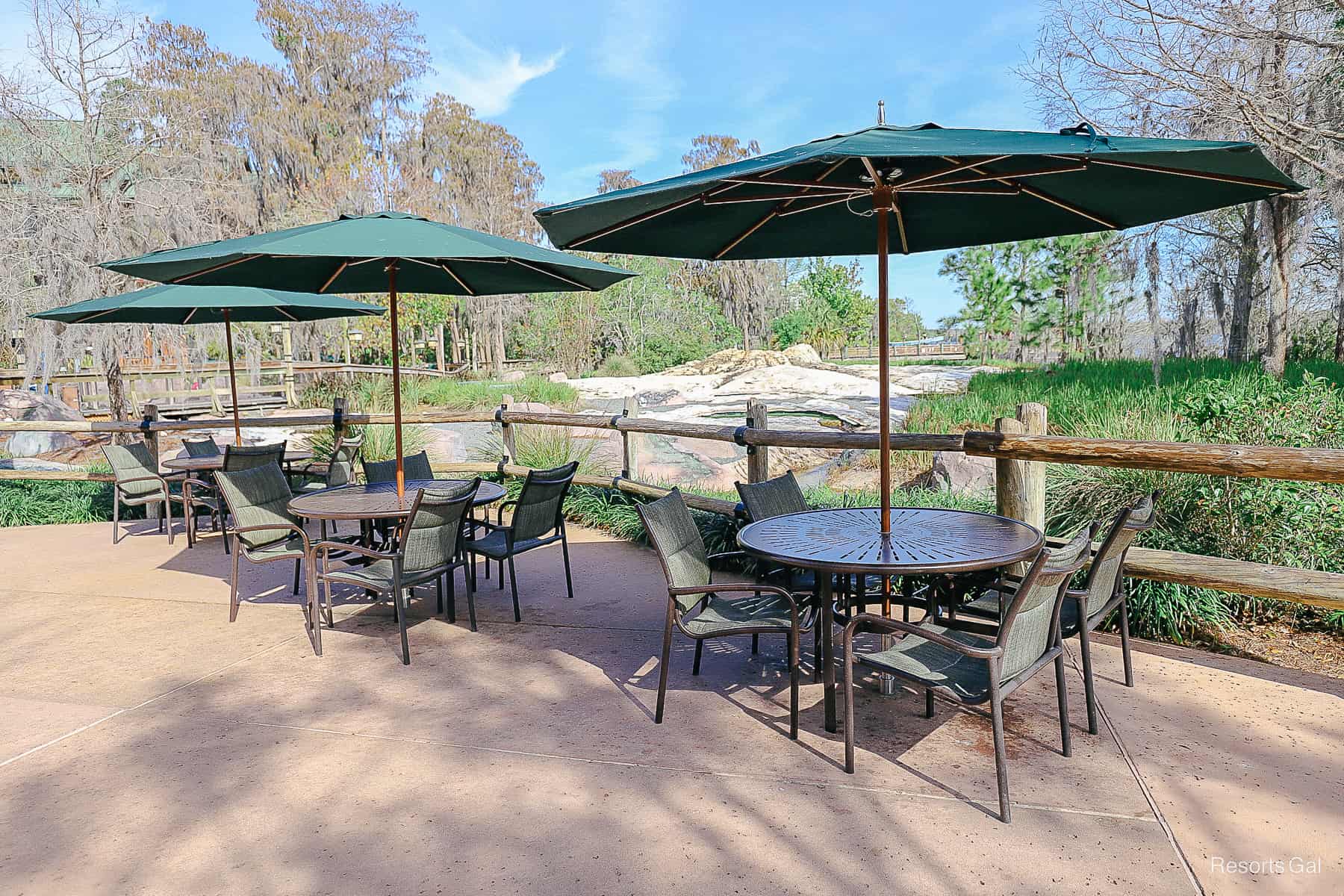 tables and chairs for dining near the pool 