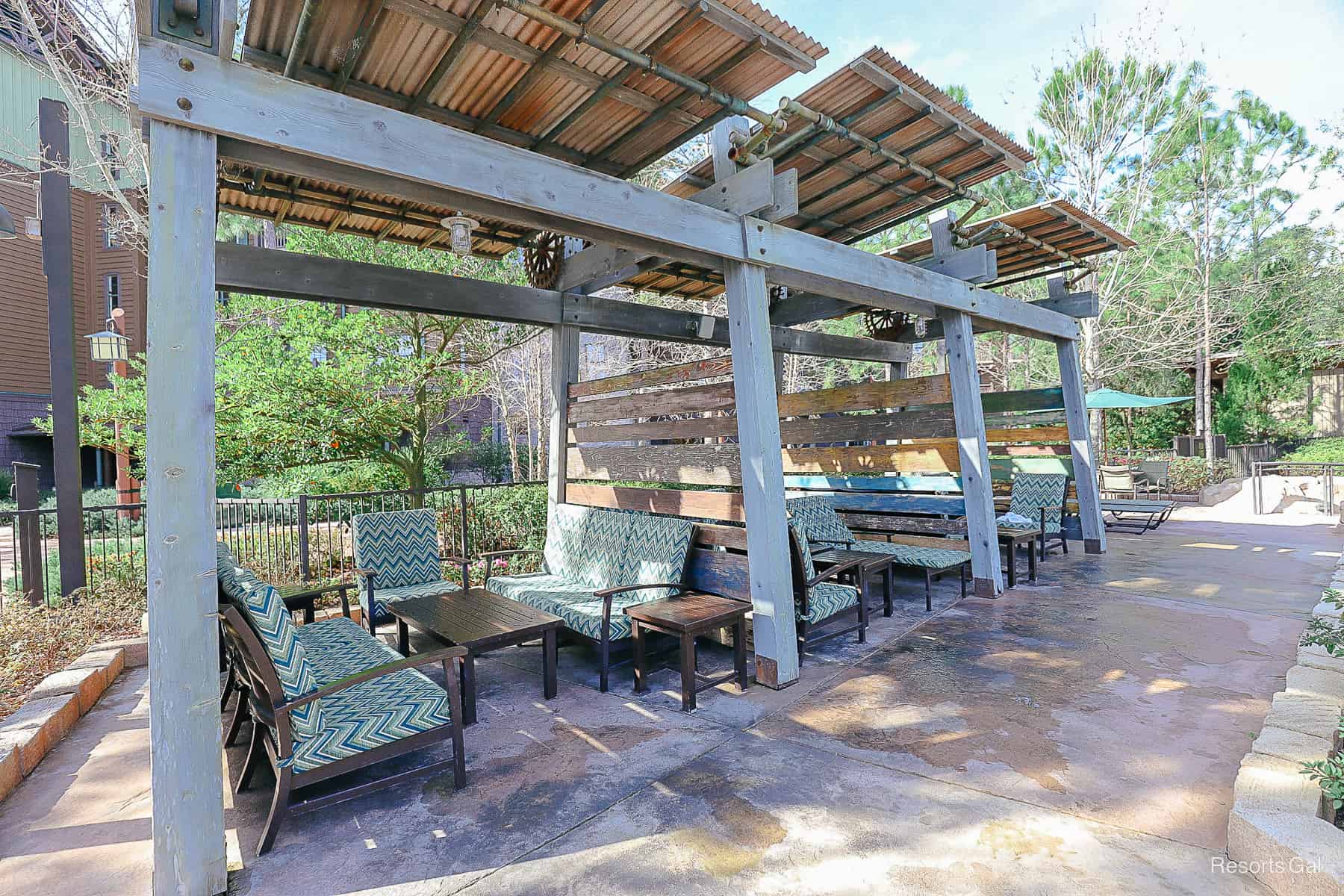 a row of covered seating areas at the Boulder Ridge Cove Pool 