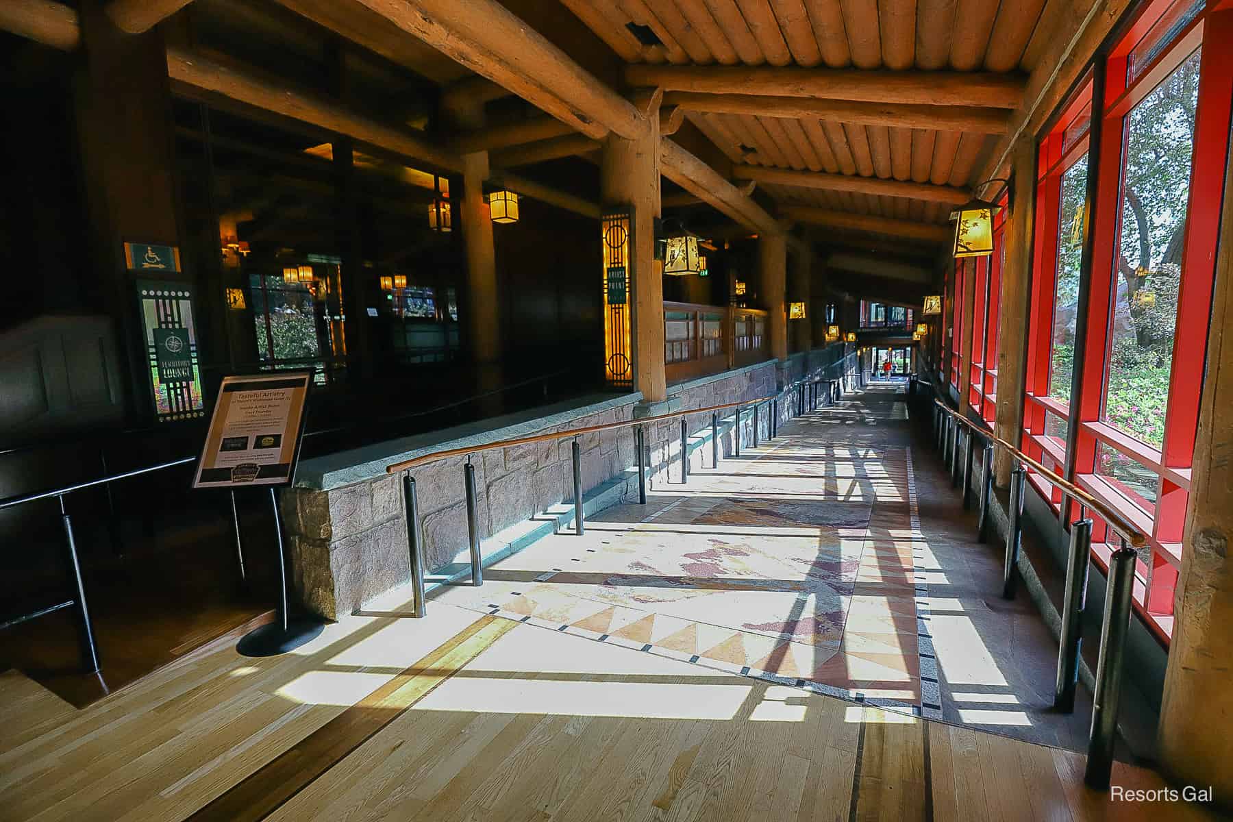 a sloped walkway that leads from the Wilderness Lodge lobby to the dining area 