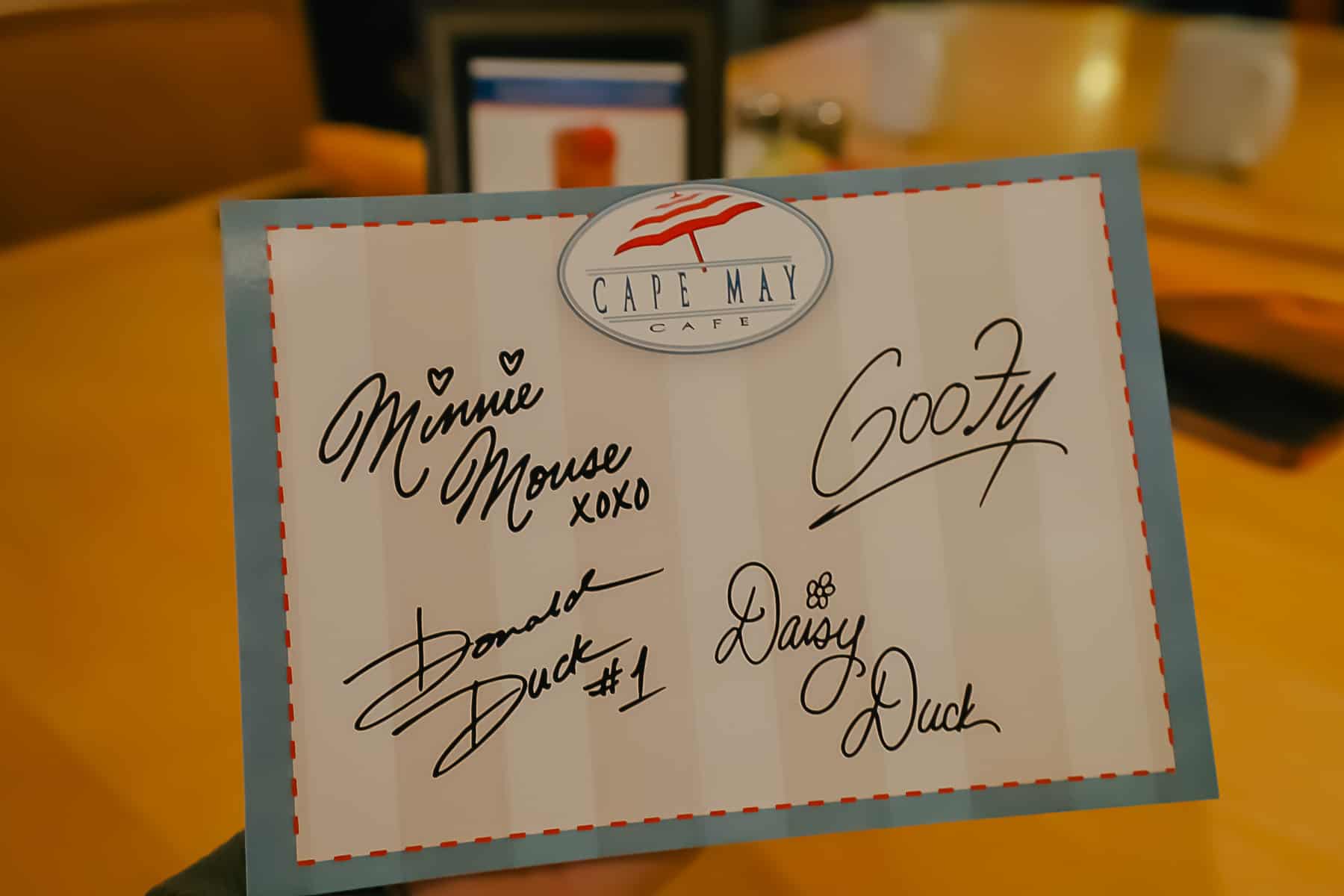 an autograph card with character's signatures from Cape May Cafe 