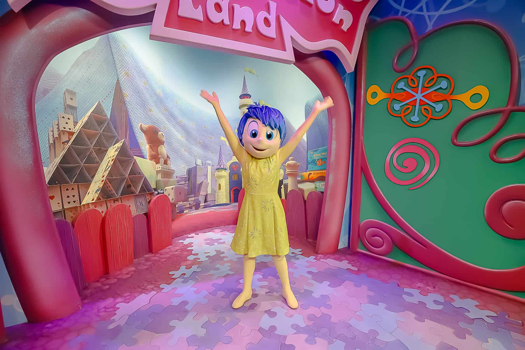 Joy from Inside out in her yellow dress with blue hair. 