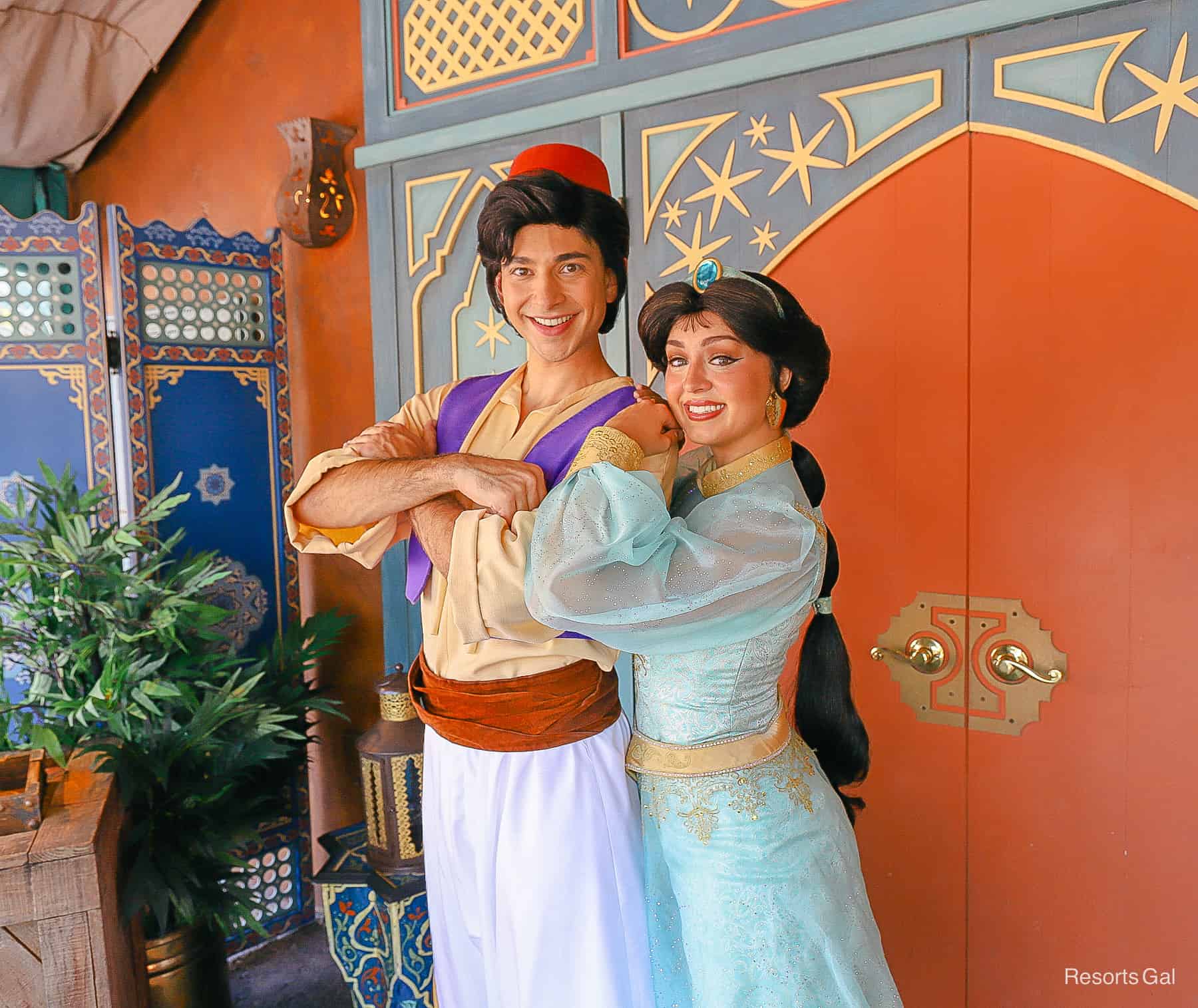Aladdin and Jasmine pose for a photo. 