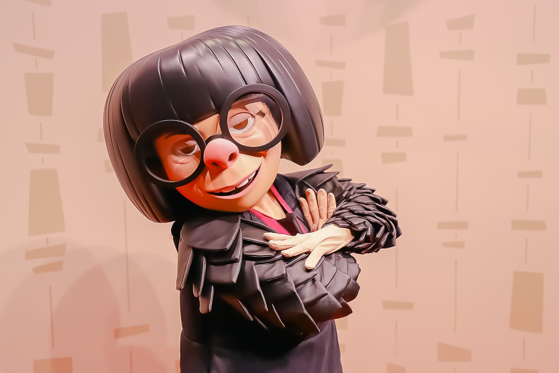 Edna Mode poses with arms crossed.