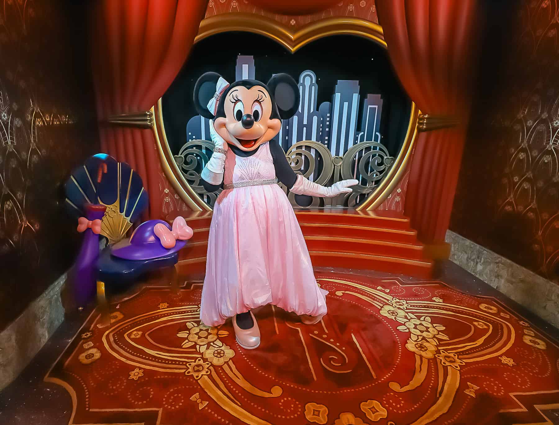 Minnie Mouse in her pink ballgown on the red carpet. 