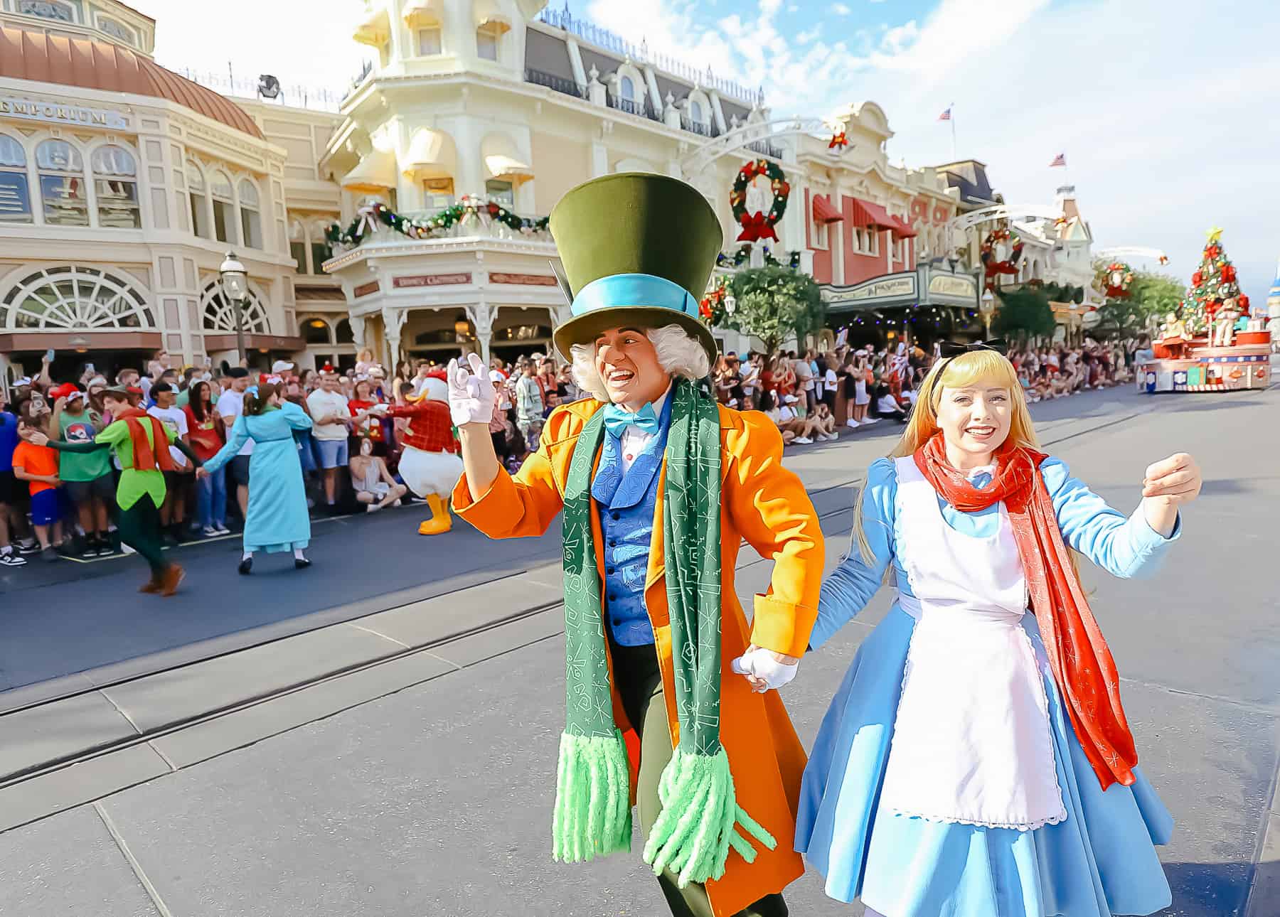 Alice and the Mad Hatter wearing Christmas scarves in the Christmas Day Parade. 