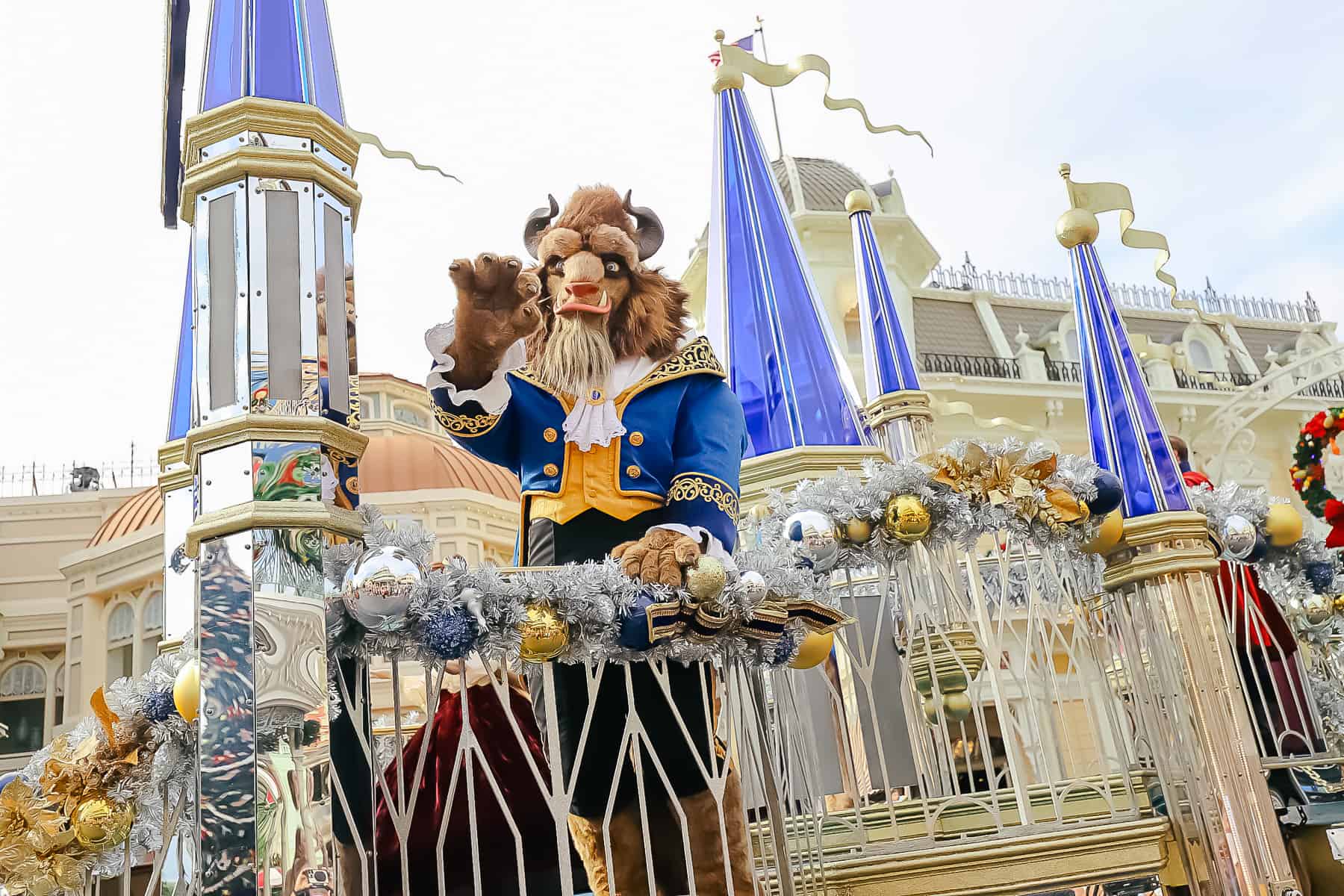 The Beast waves to parade crowds. 