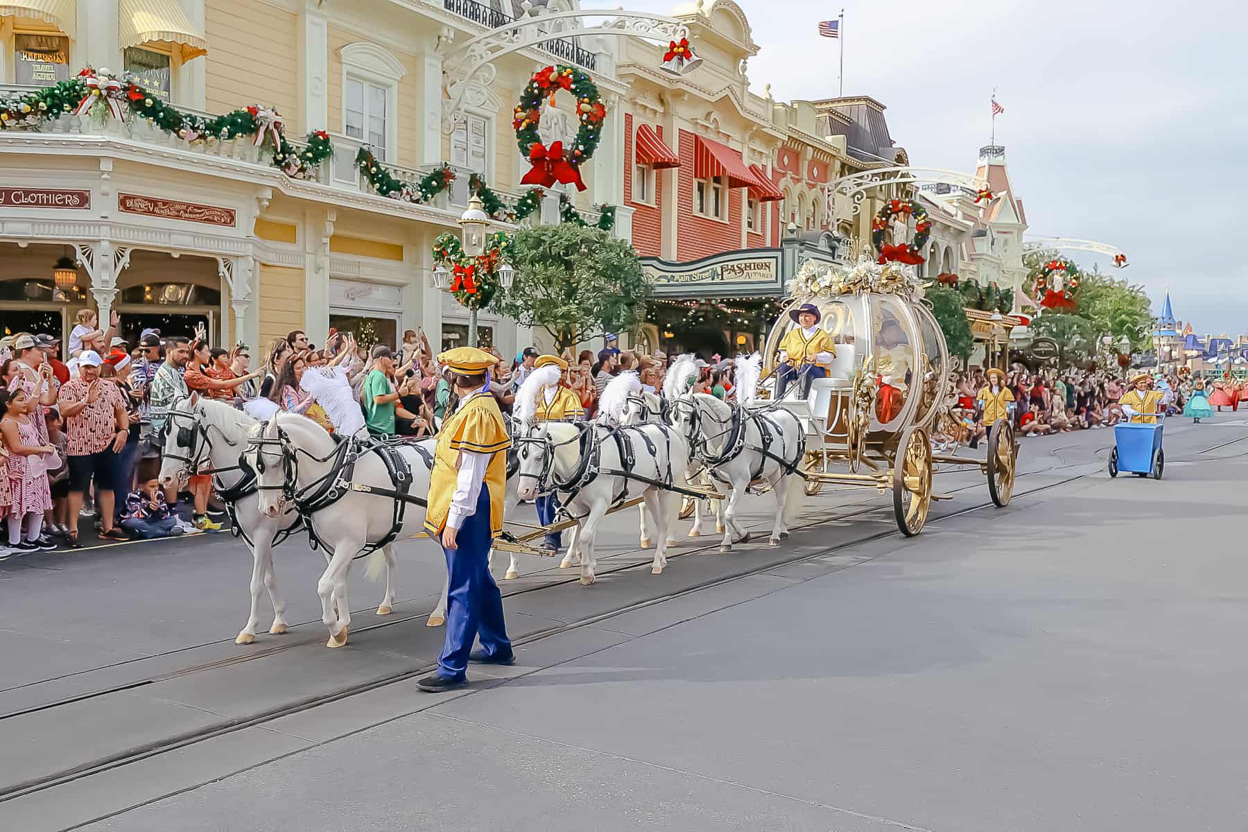 Daytime view of Cinderella's horses pulling her carriage. 