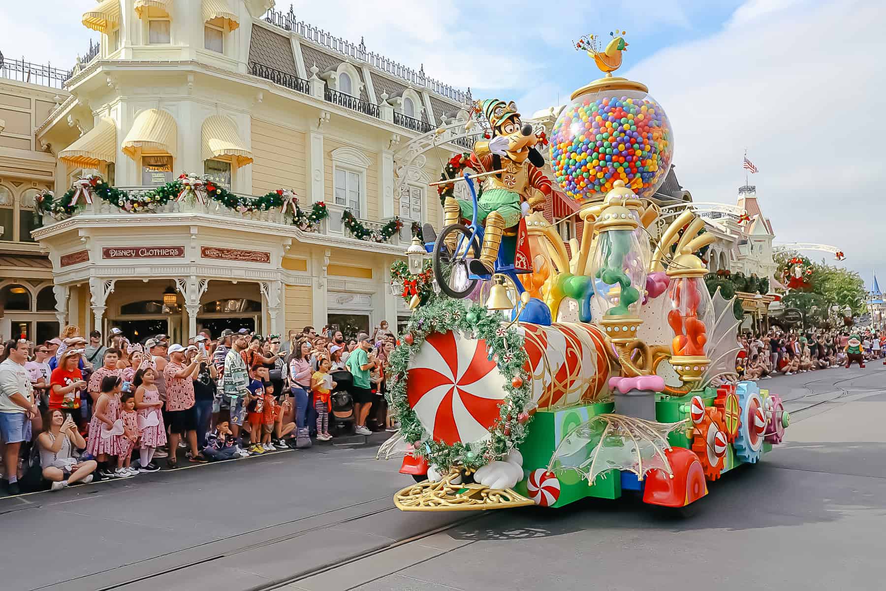 Goofy waves to the crowd from his Christmas parade float. 