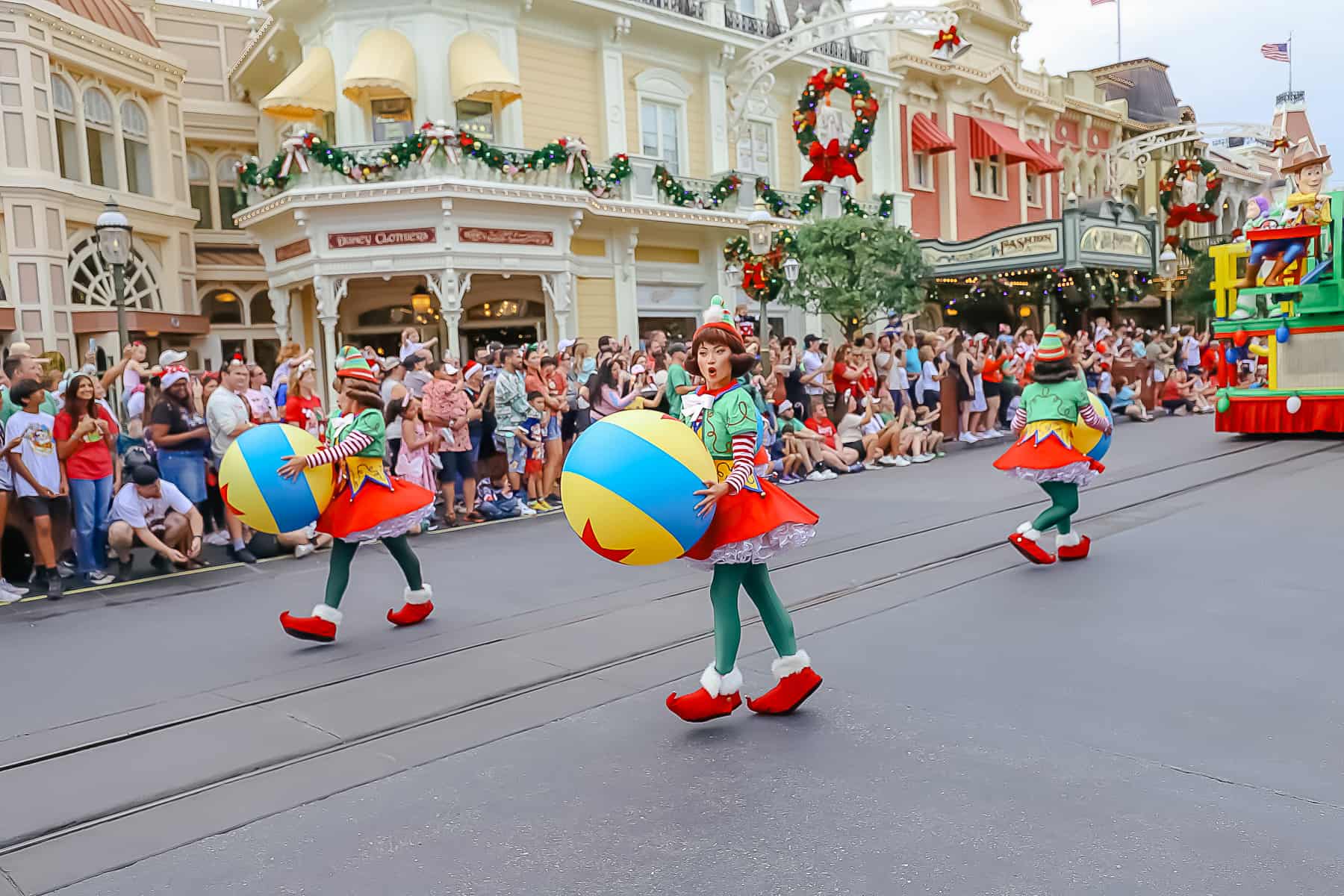 Elves carrying overside Pixar bouncing balls. 