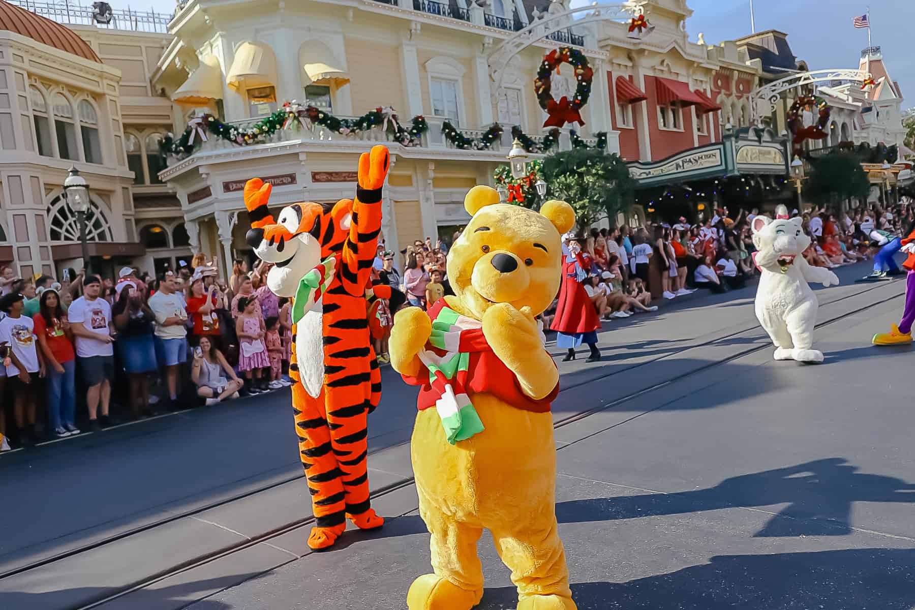 Winnie the Pooh blows a kiss to the crowd in the parade. 