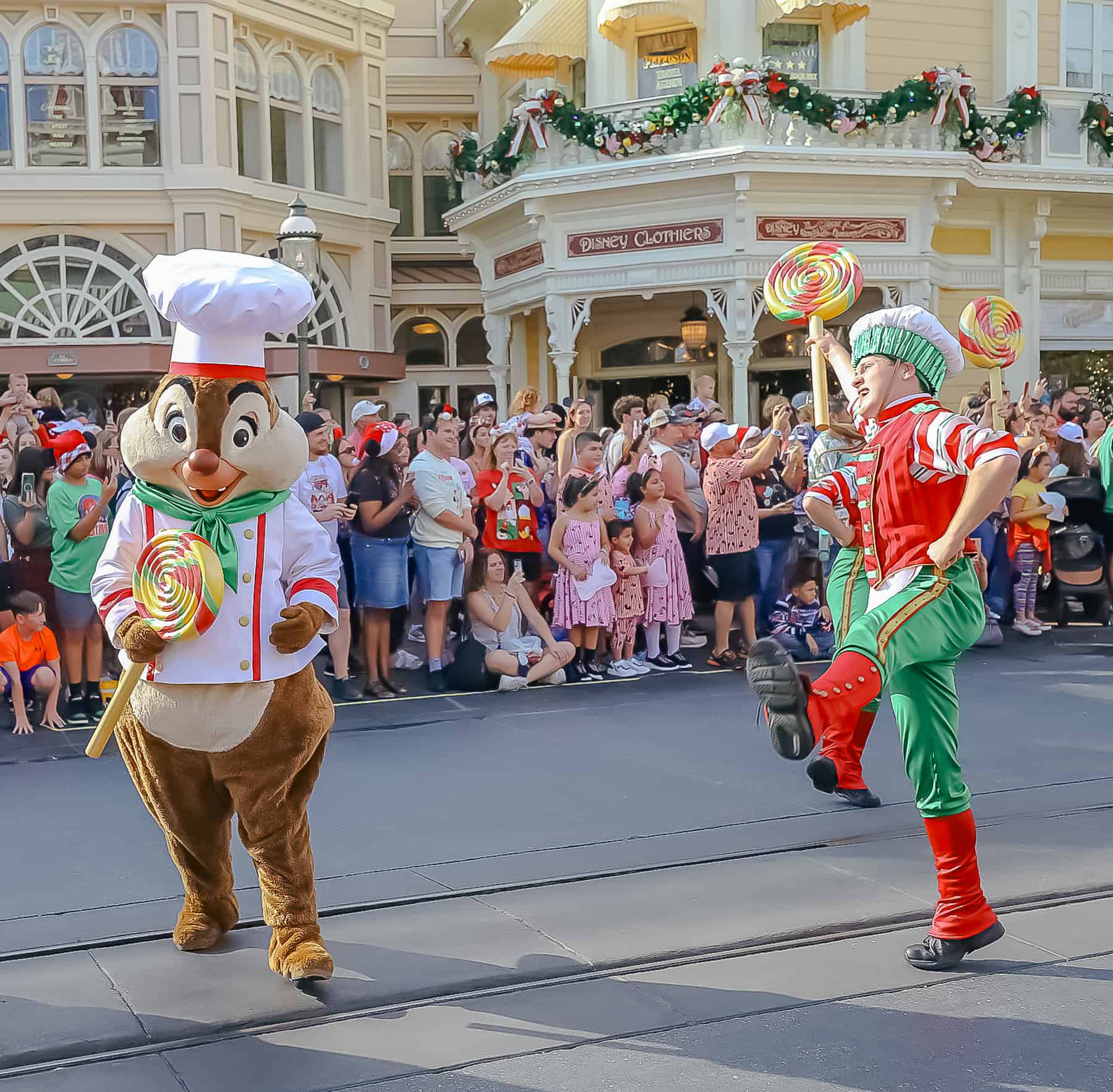 Dale with a dance carrying a large lollipop. 