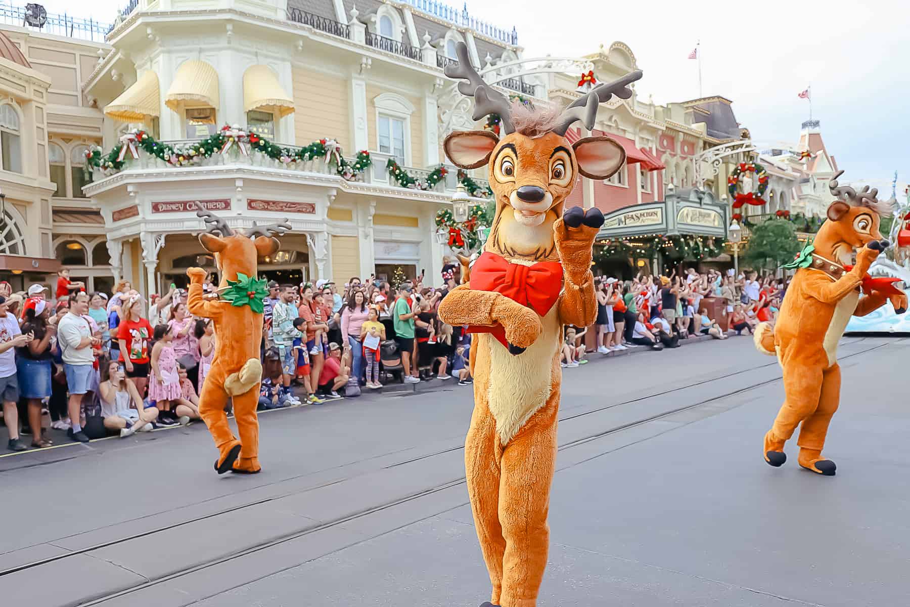 A reindeer waves to the crowd. 