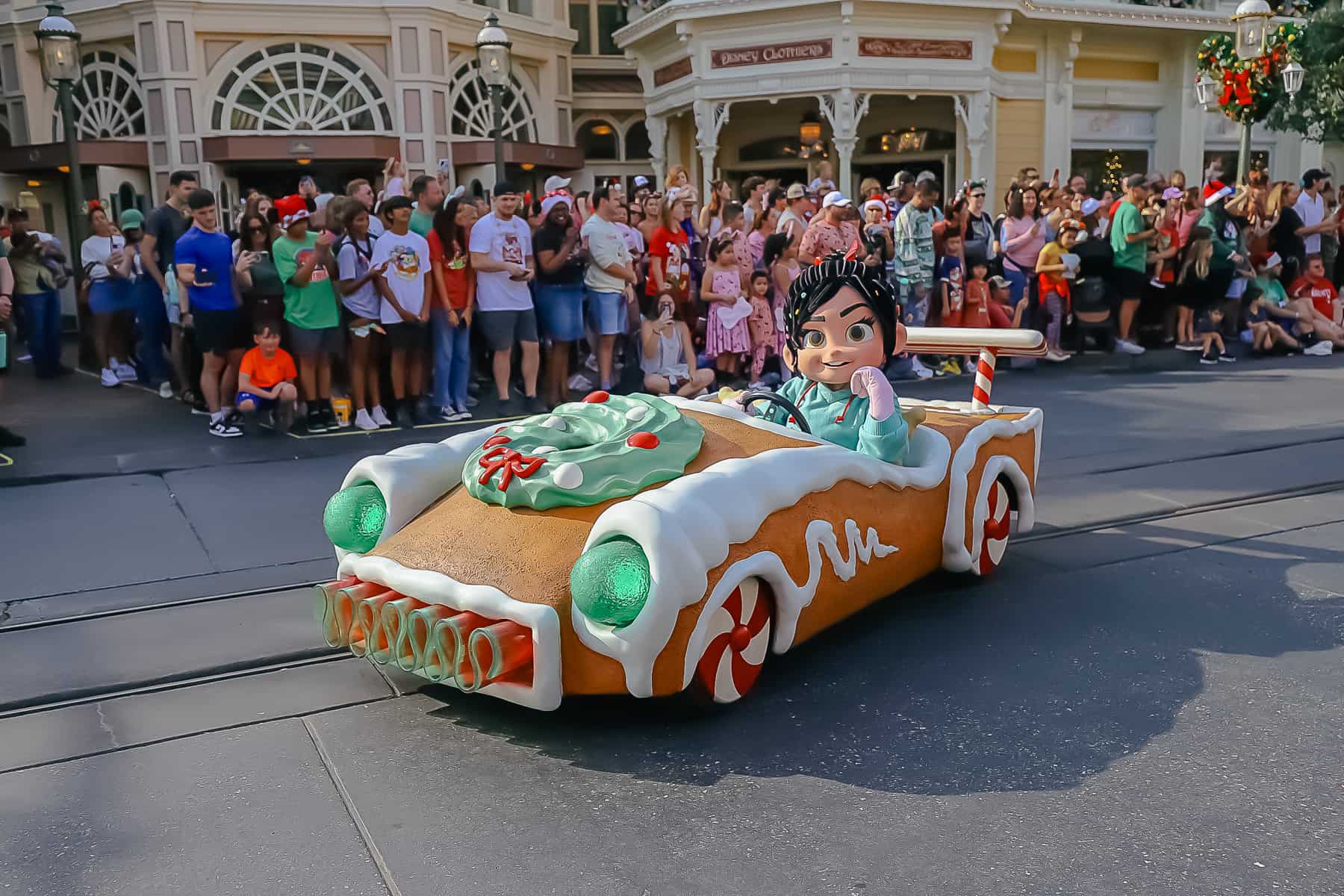 Vanellope Von Schweetz stops to pose for a photo during the Once Upon a Christmastime Parade. 