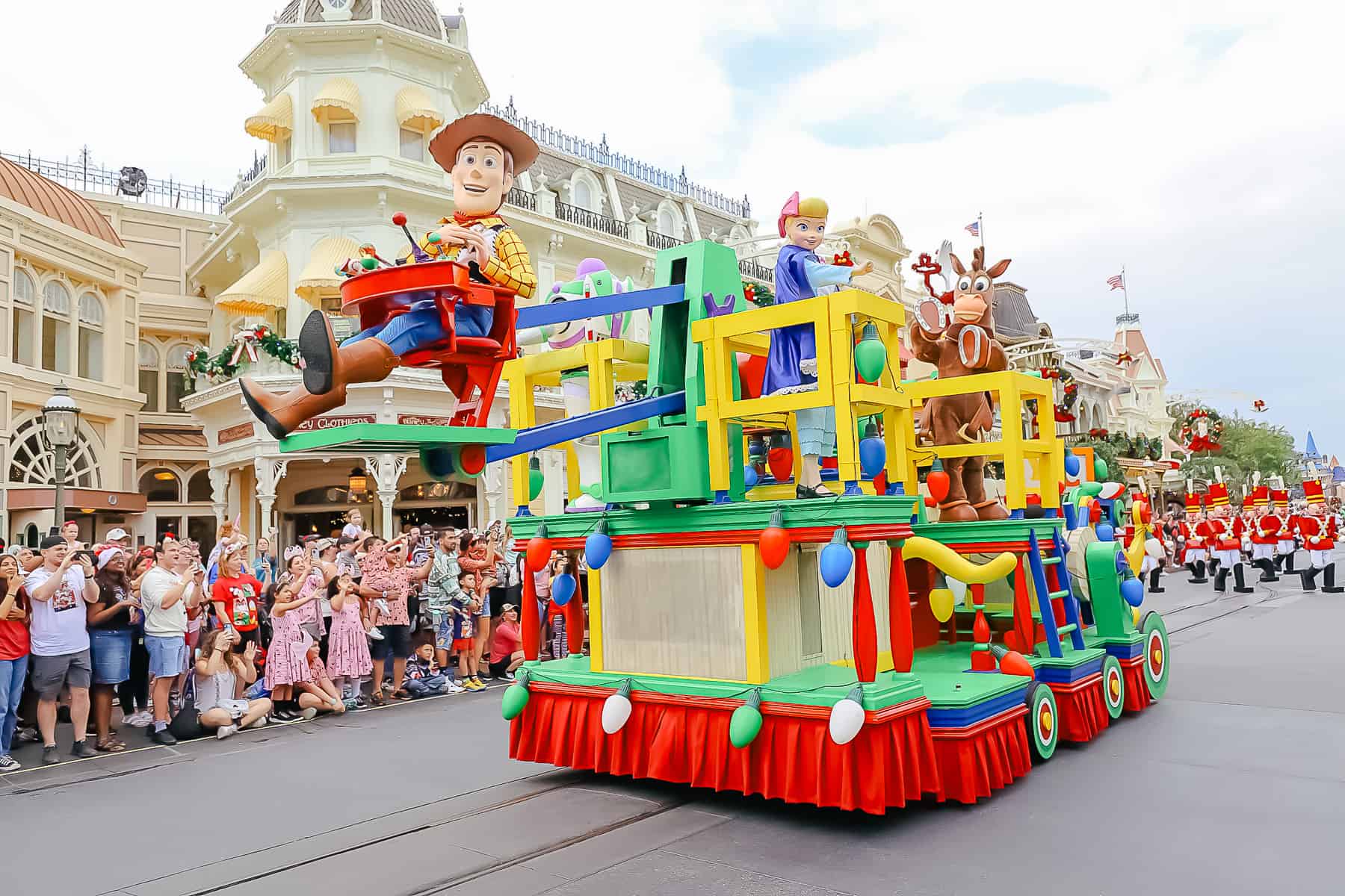 The Toy Story parade float with Woody, Bo Peep, Buzz Lightyear, and Bullseye. 