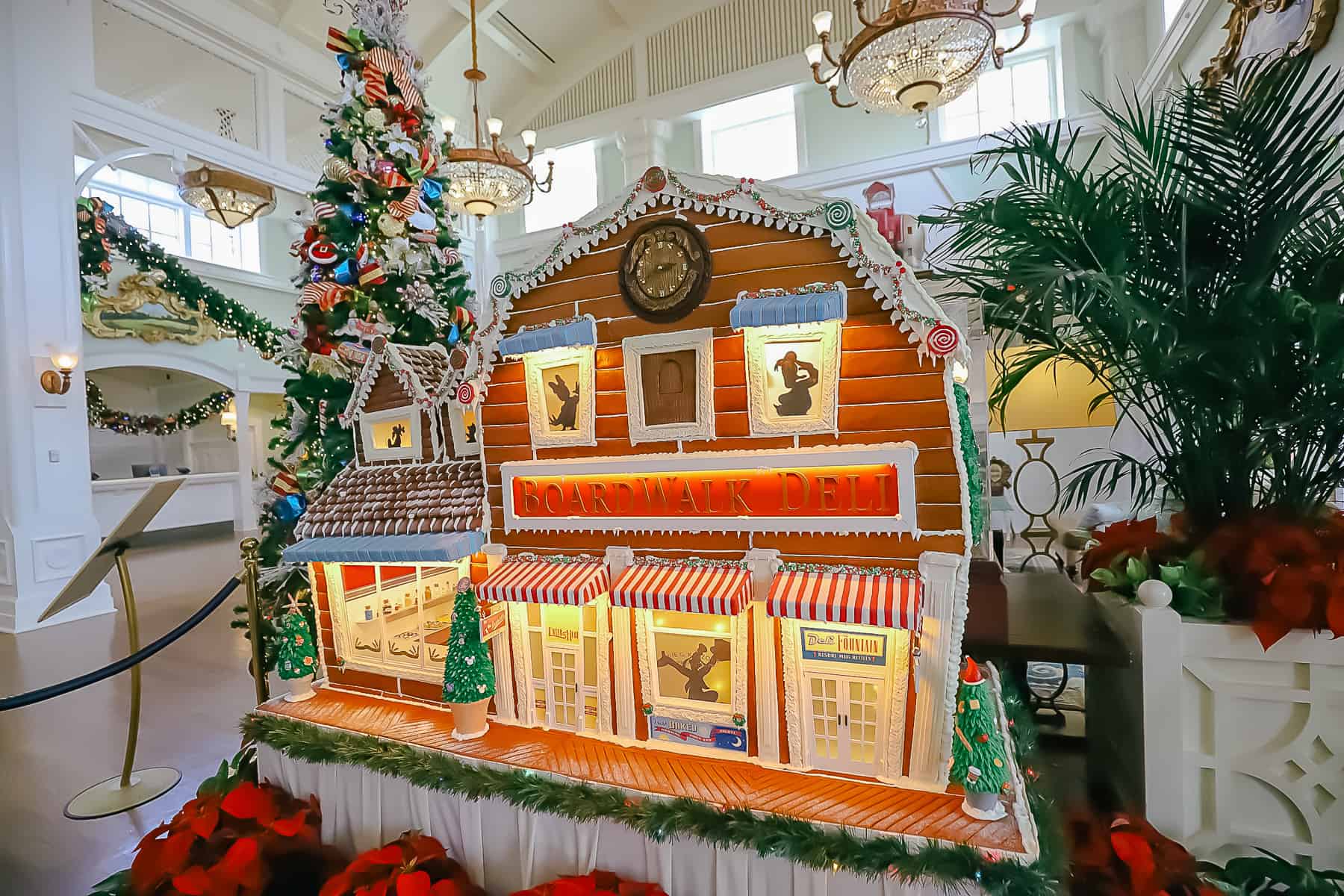 The gingerbread house at Disney's Boardwalk Inn with tree sitting behind it. 