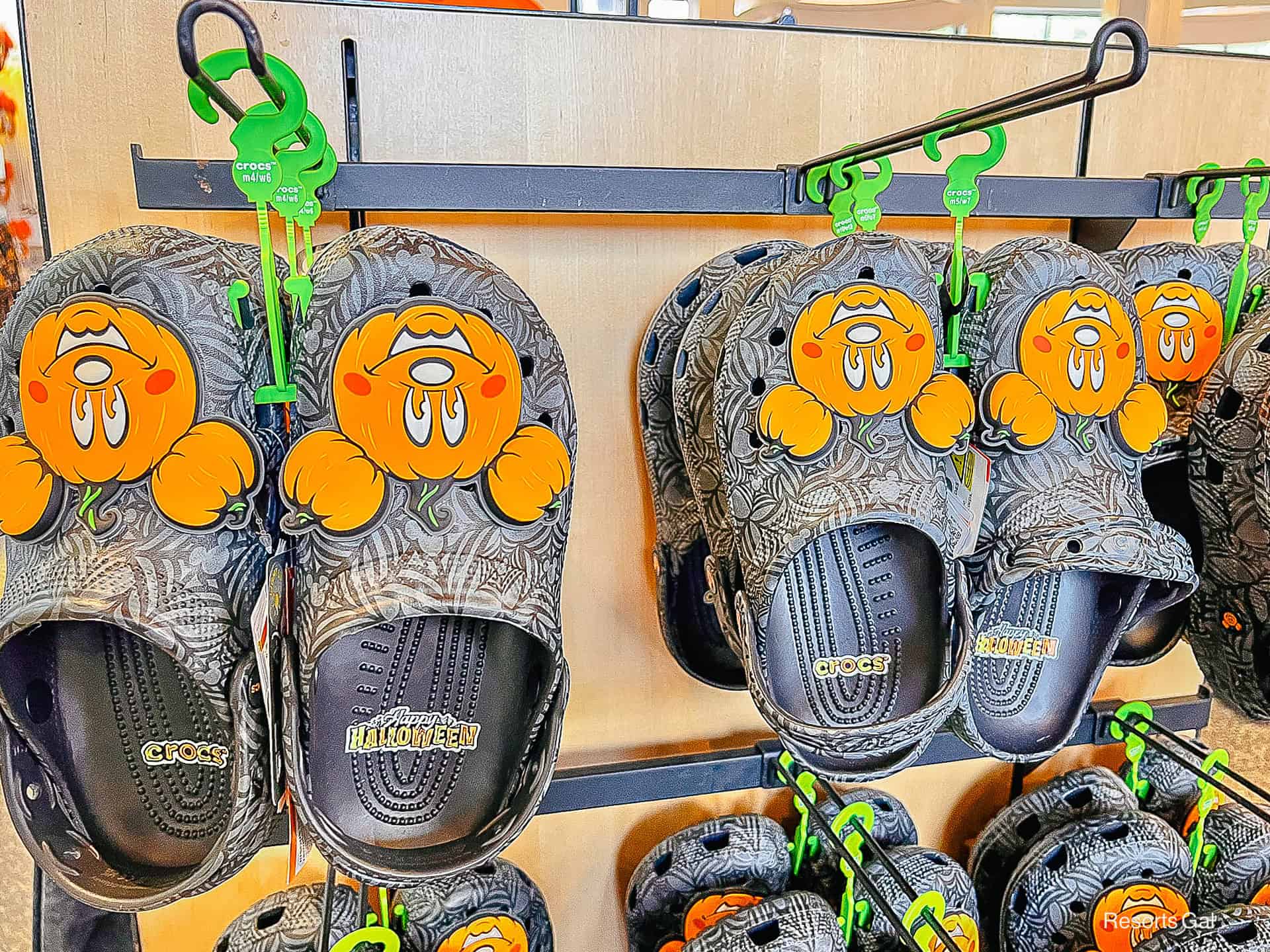 a pair of Mickey Mouse orange pumpkin crocks