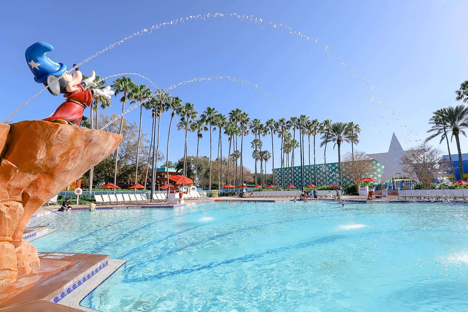 Sorcerer Mickey spraying water into the pool. 