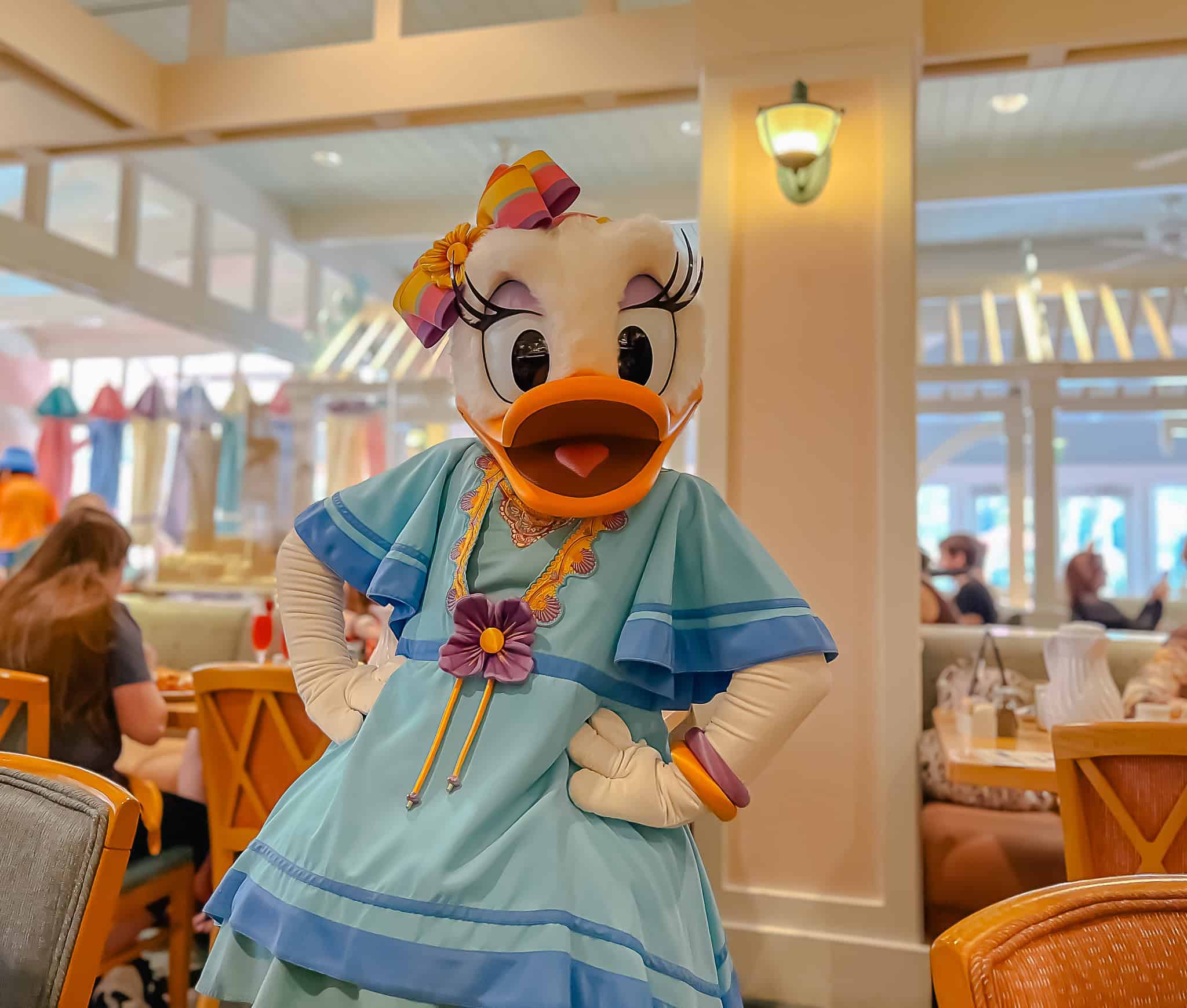 Daisy at Cape May Cafe poses for a photo for a Disney World Dining Review 