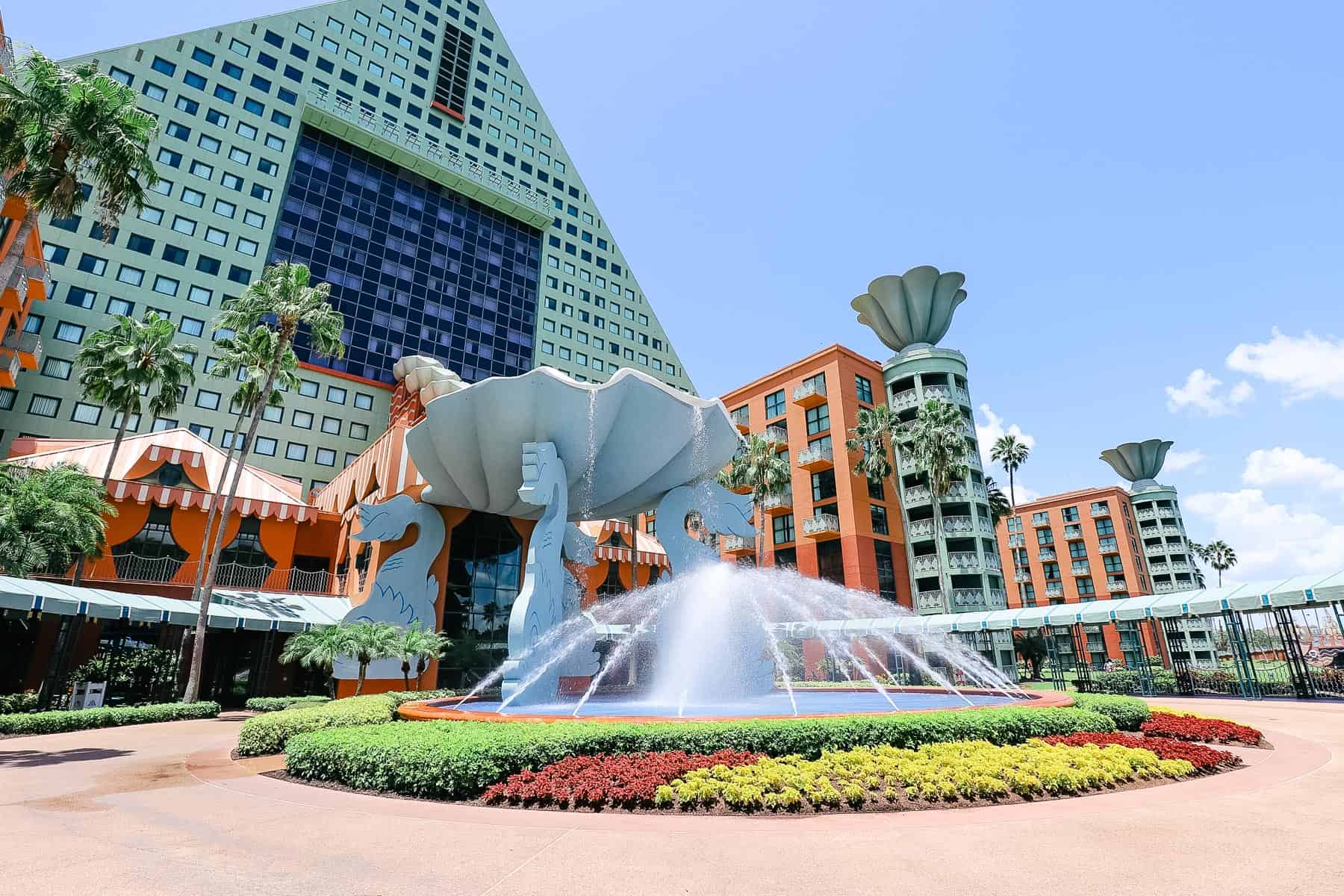 a fountain with landscaping in front of the Dolphin hotel 