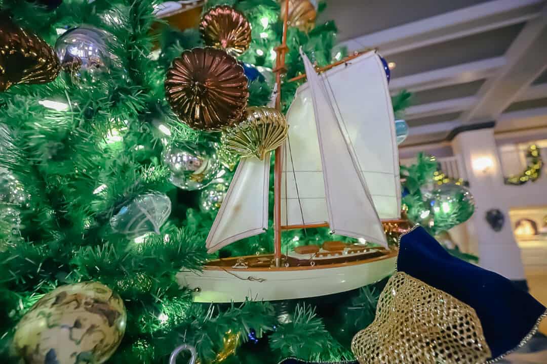 A large sailboat that looks like it's sailing on the Christmas tree. 