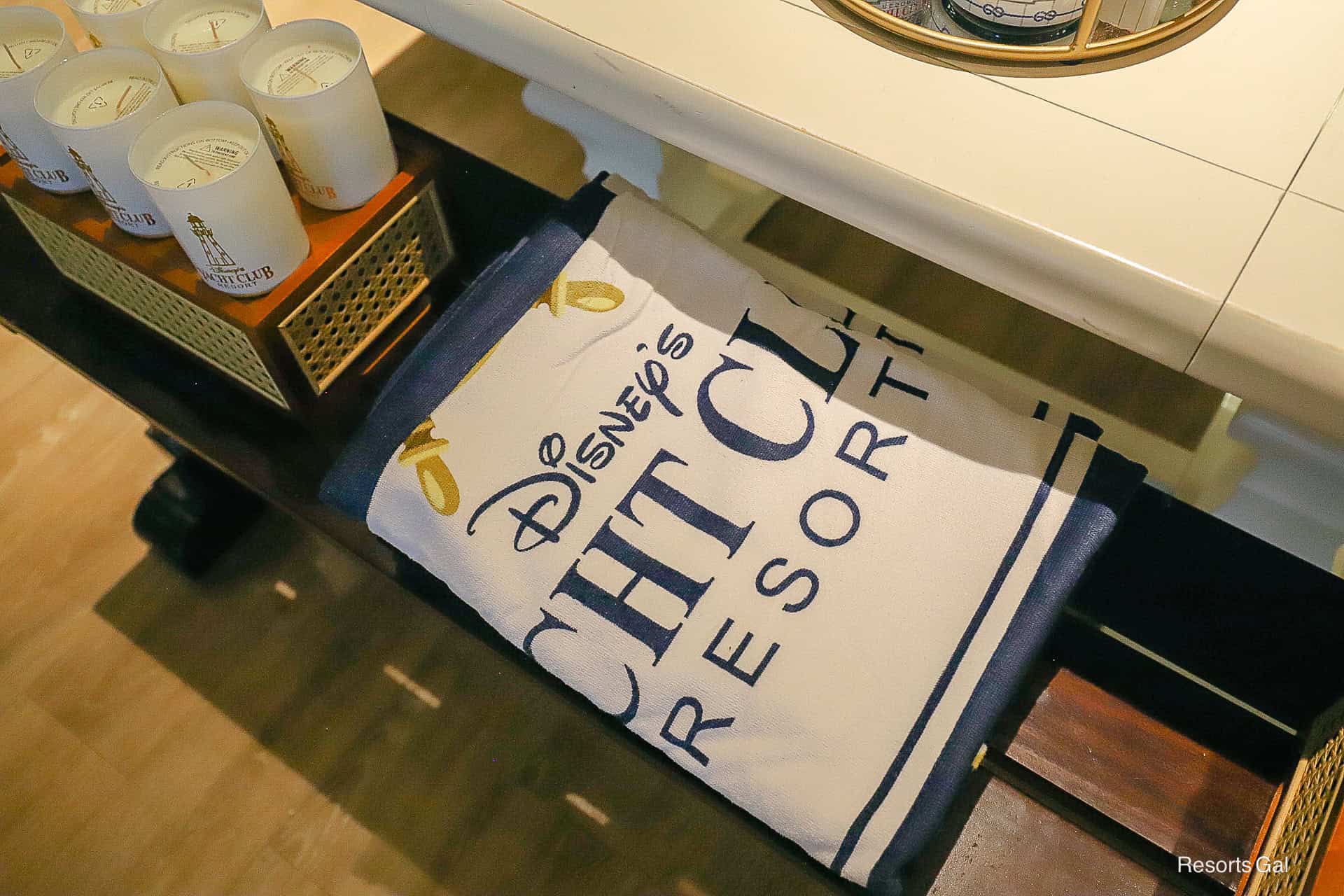 a beach towel with the Yacht Club's logo