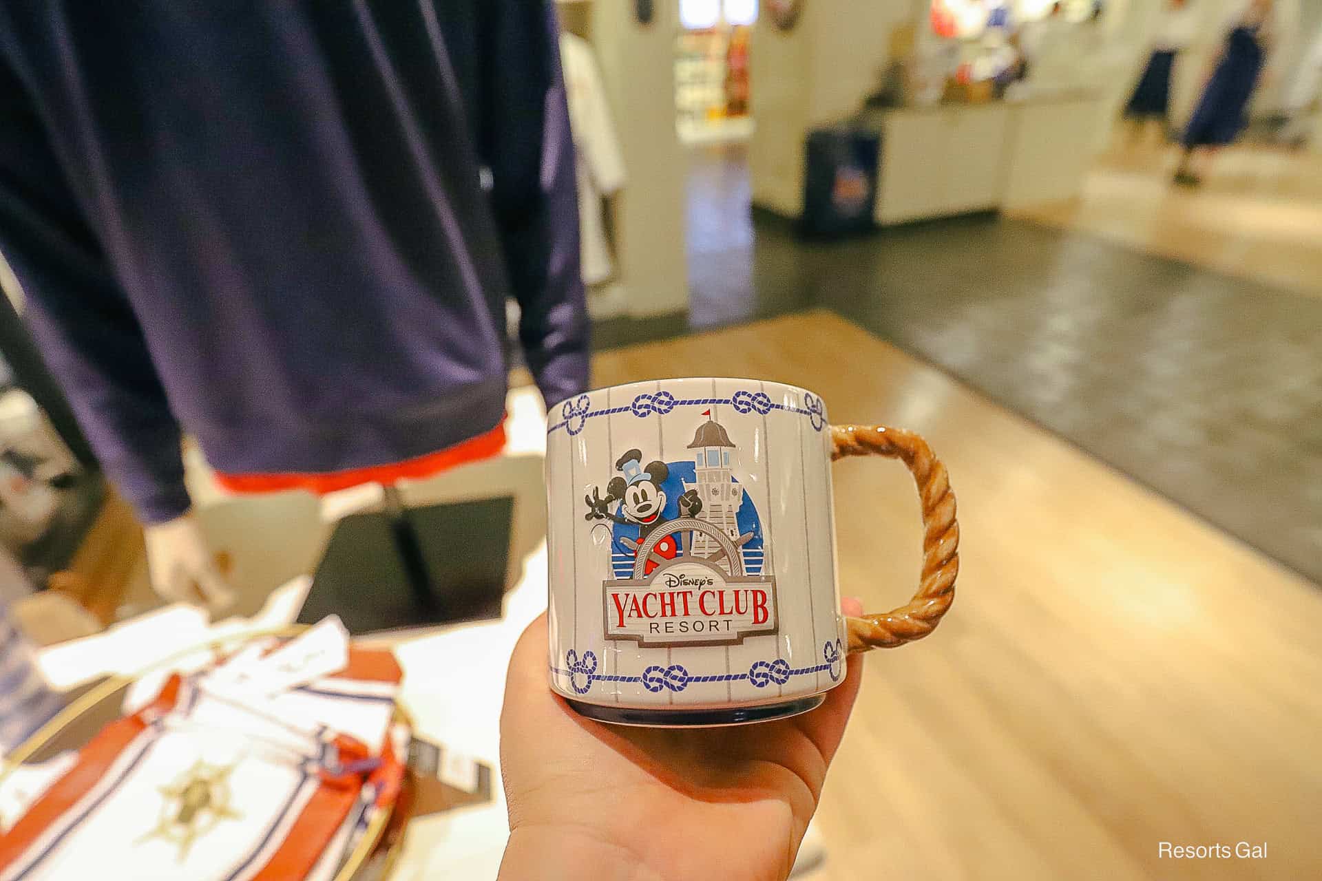 front of Yacht Club coffee mug with Mickey Mouse