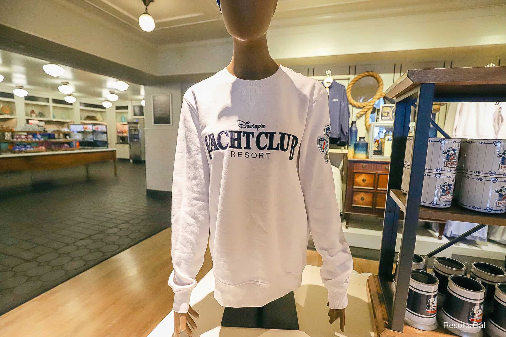 the white sweatshirt displayed on a mannequin
