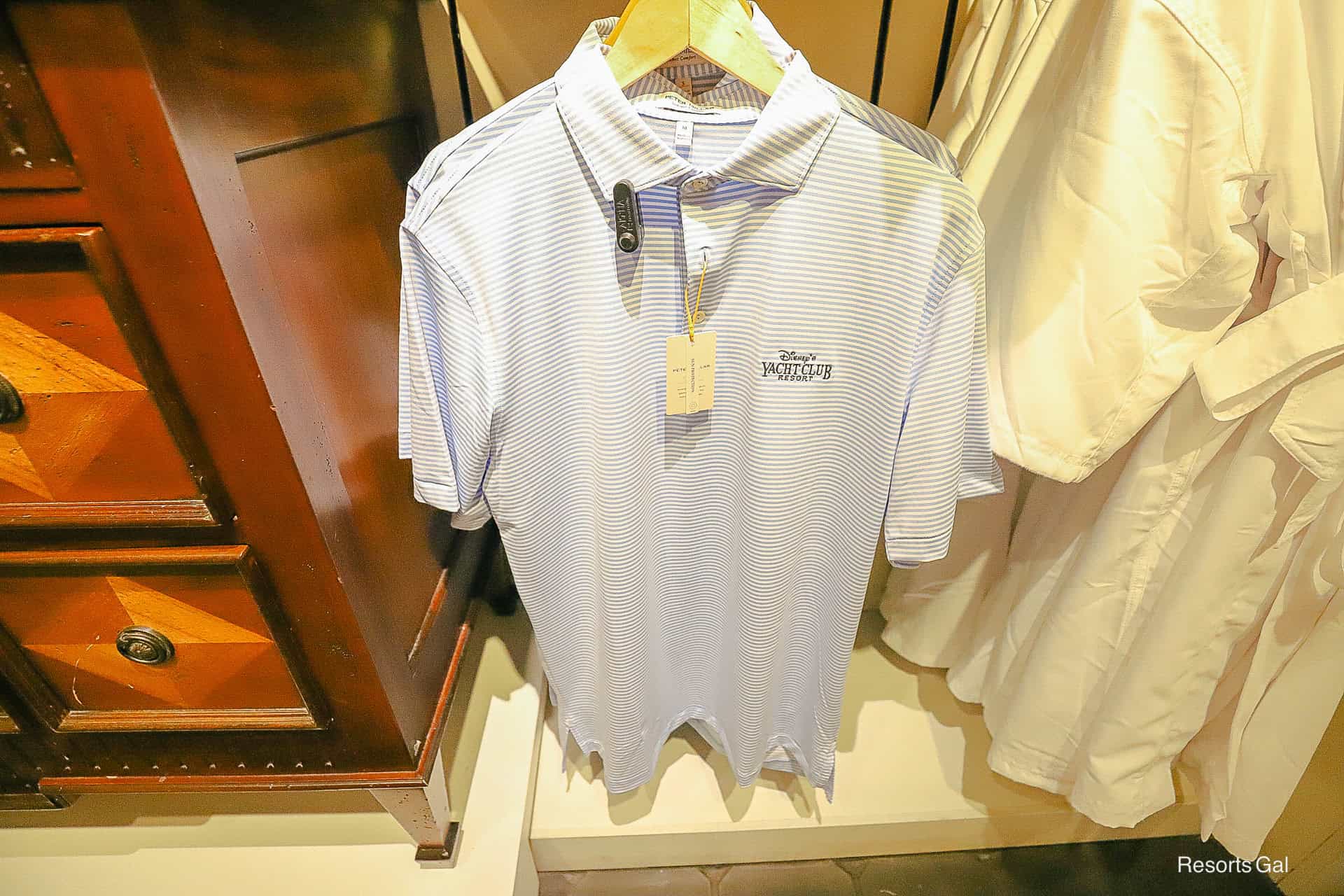 cottage blue striped Peter Miller Polo with the Yacht Club logo