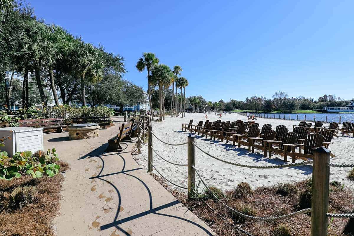 a beach shared between Beach and Yacht Club with rows of wooden chairs 