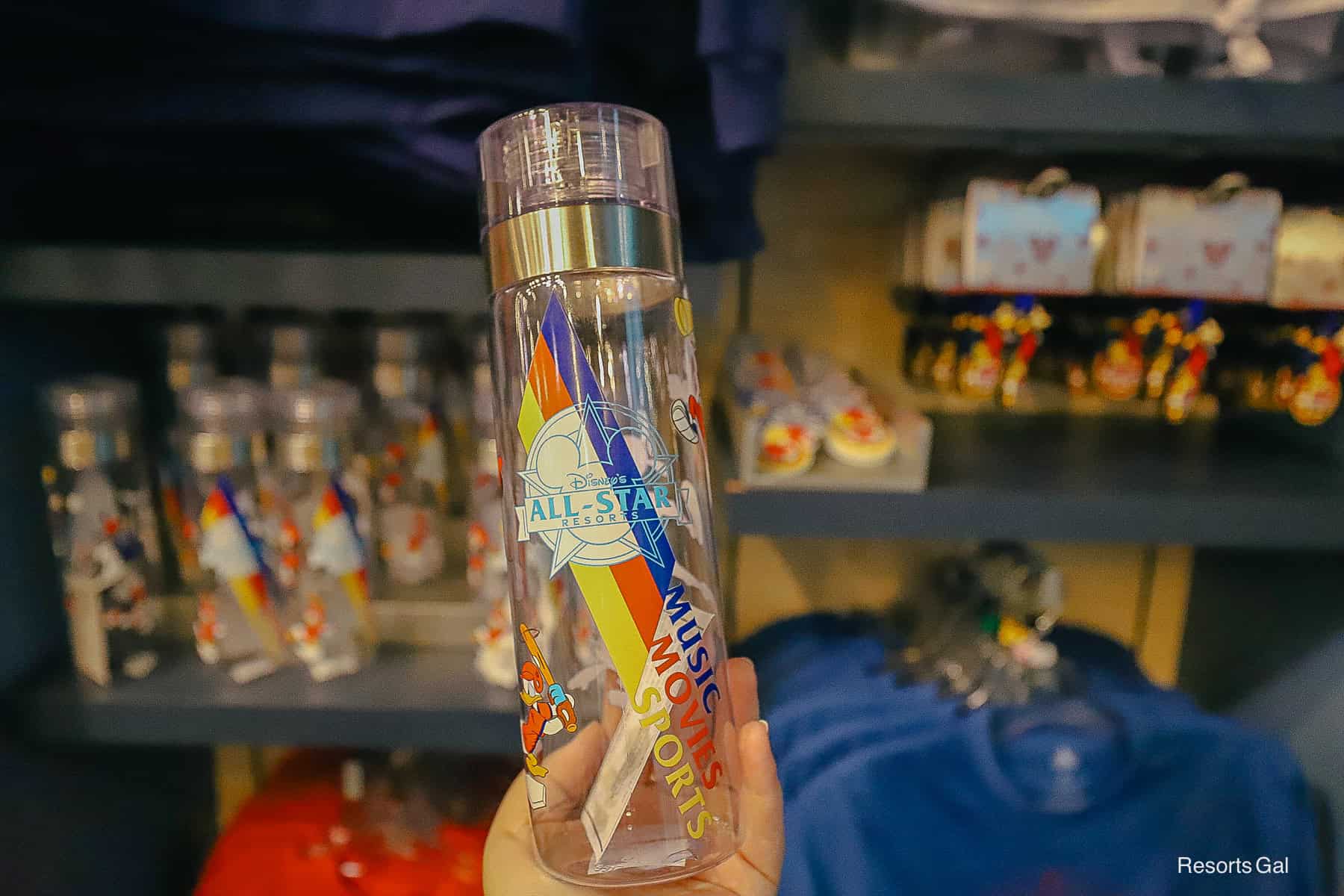 a clear tumbler with designs for the All-Star Resorts 