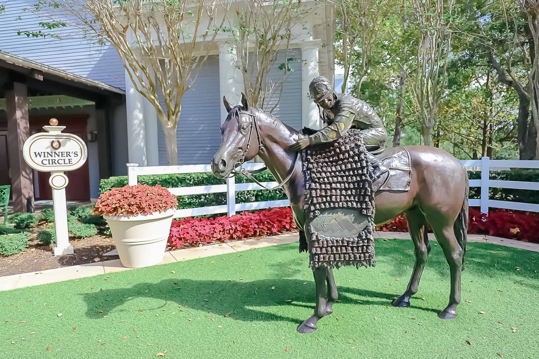 An iron statue of a jockey at an area called the winner's circle at Disney's Saratoga Springs. 