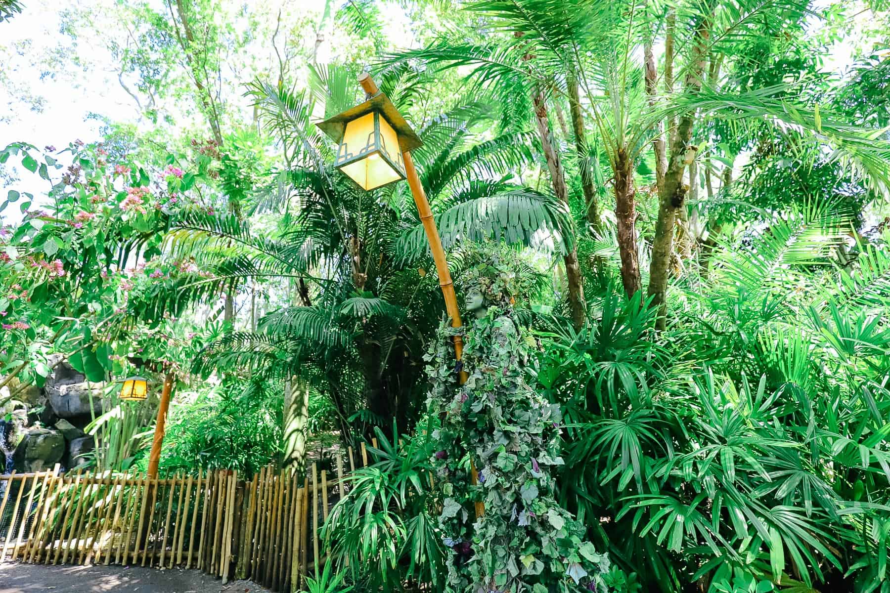 Di'vine wrapped around a lightpole in The Oasis at Disney's Animal Kingdom 
