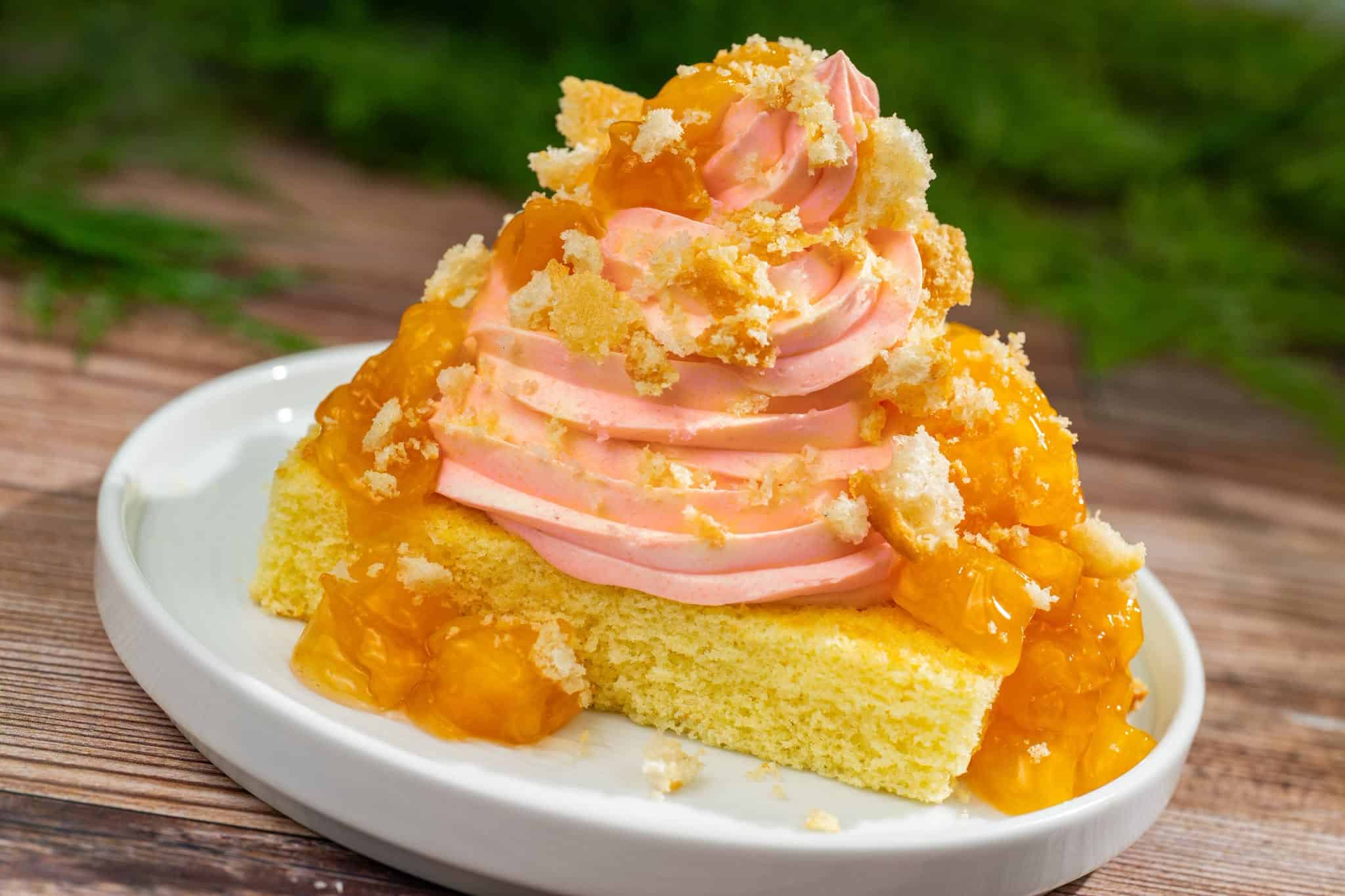 a cake topped with peach Dole Whip and toppings