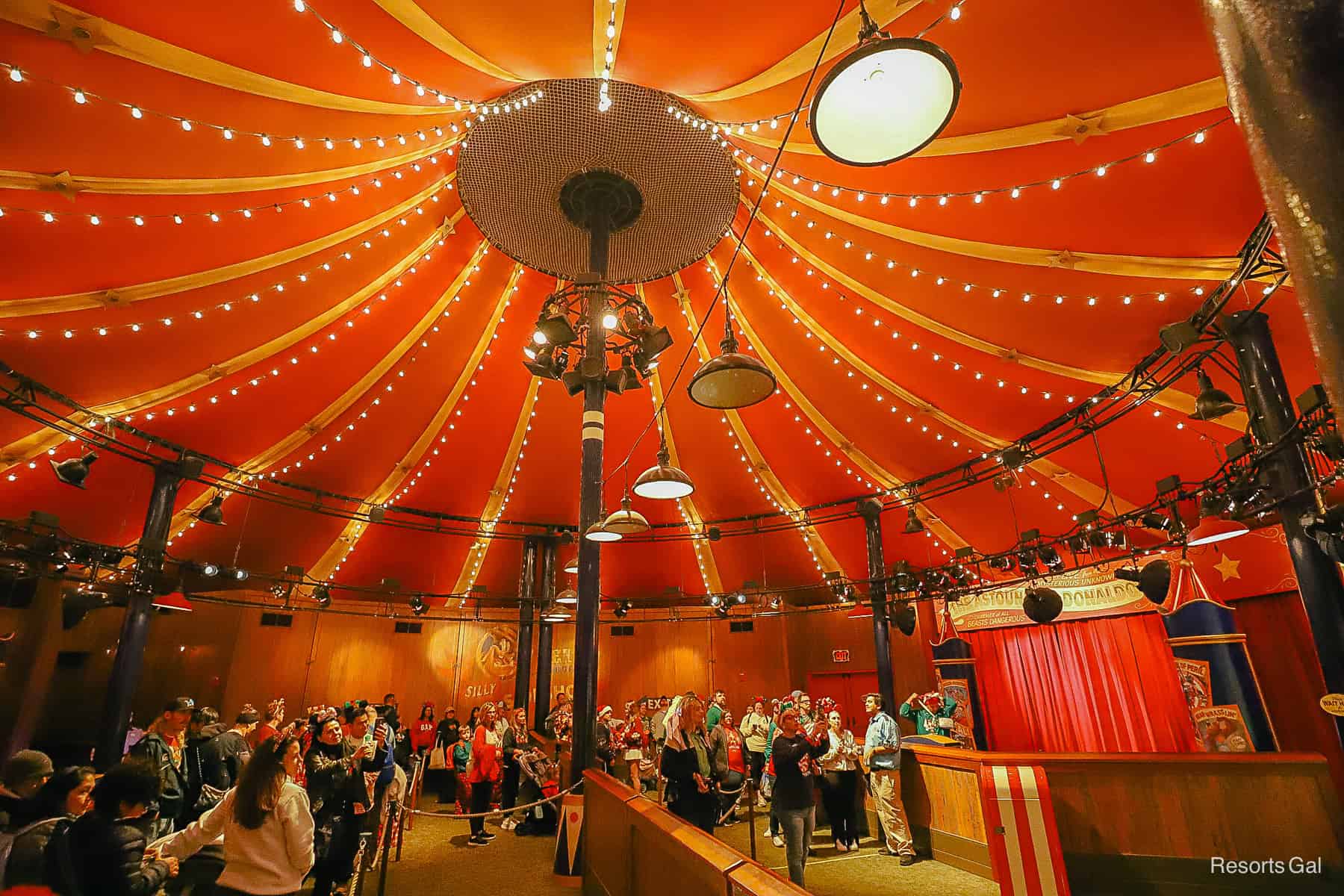 guests waiting inside Pete's Silly Sideshow to meet Donald and Daisy Duck with Scrooge at the Christmas Party 