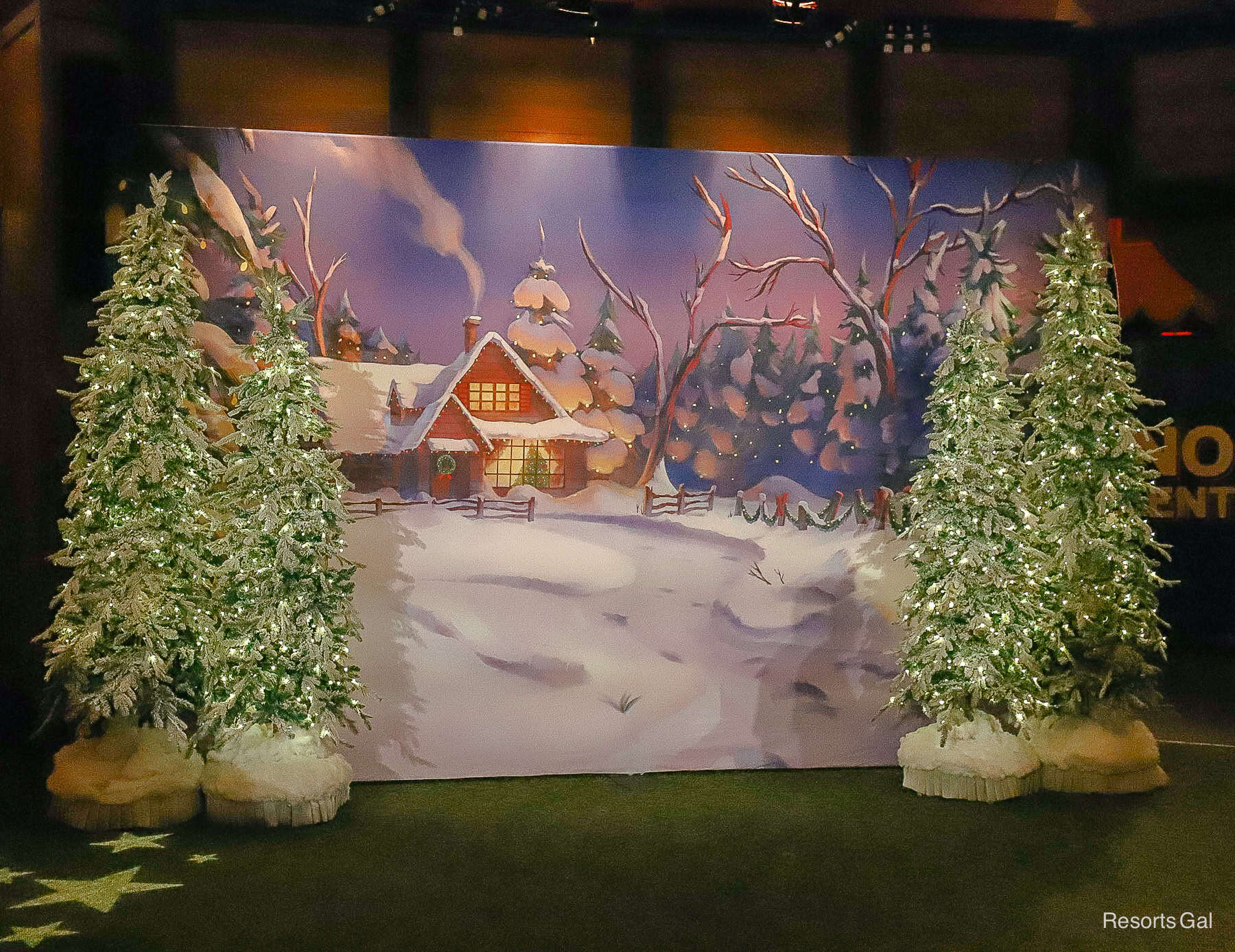 the backdrop of the character meet-and-greet is a winter scene 