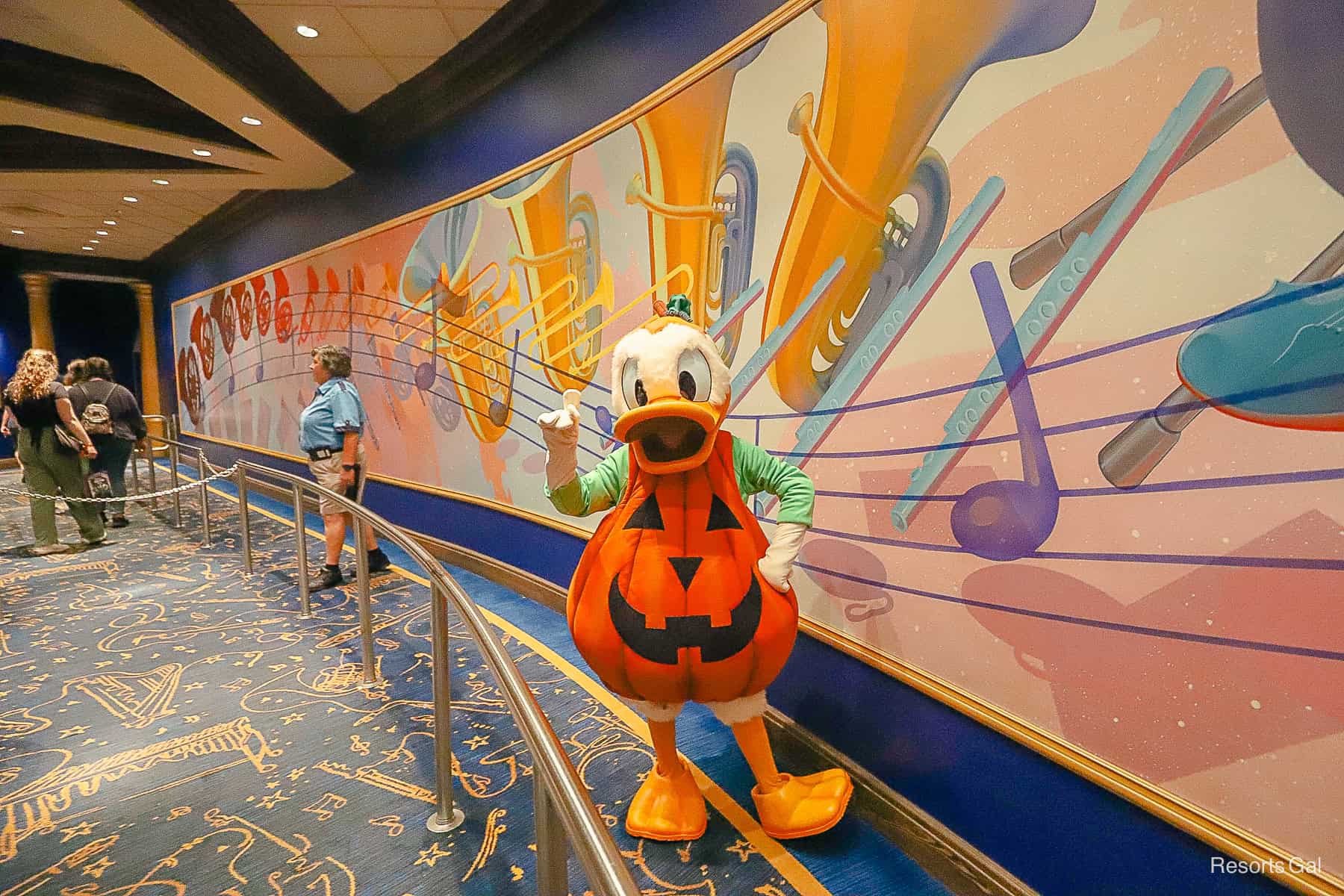 Donald Duck poses with a number 1 at the Halloween Party
