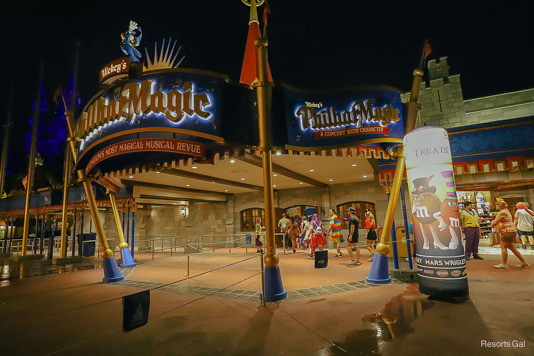 the entrance of PhilharMagic with guests waiting to trick-or-treat