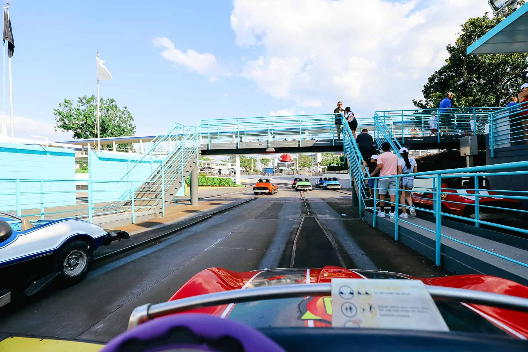 Driving a car on the Speedway. 