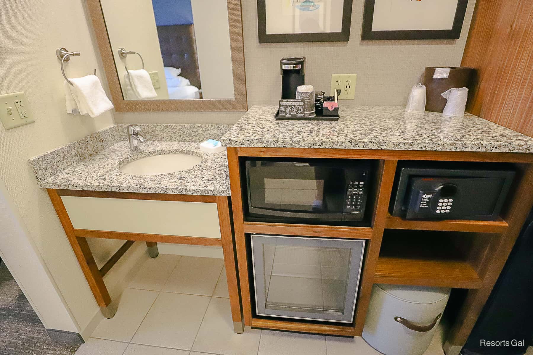 Amenities in the room include an extra sink, vanity, microwave, mini fridge and in-room safe. 