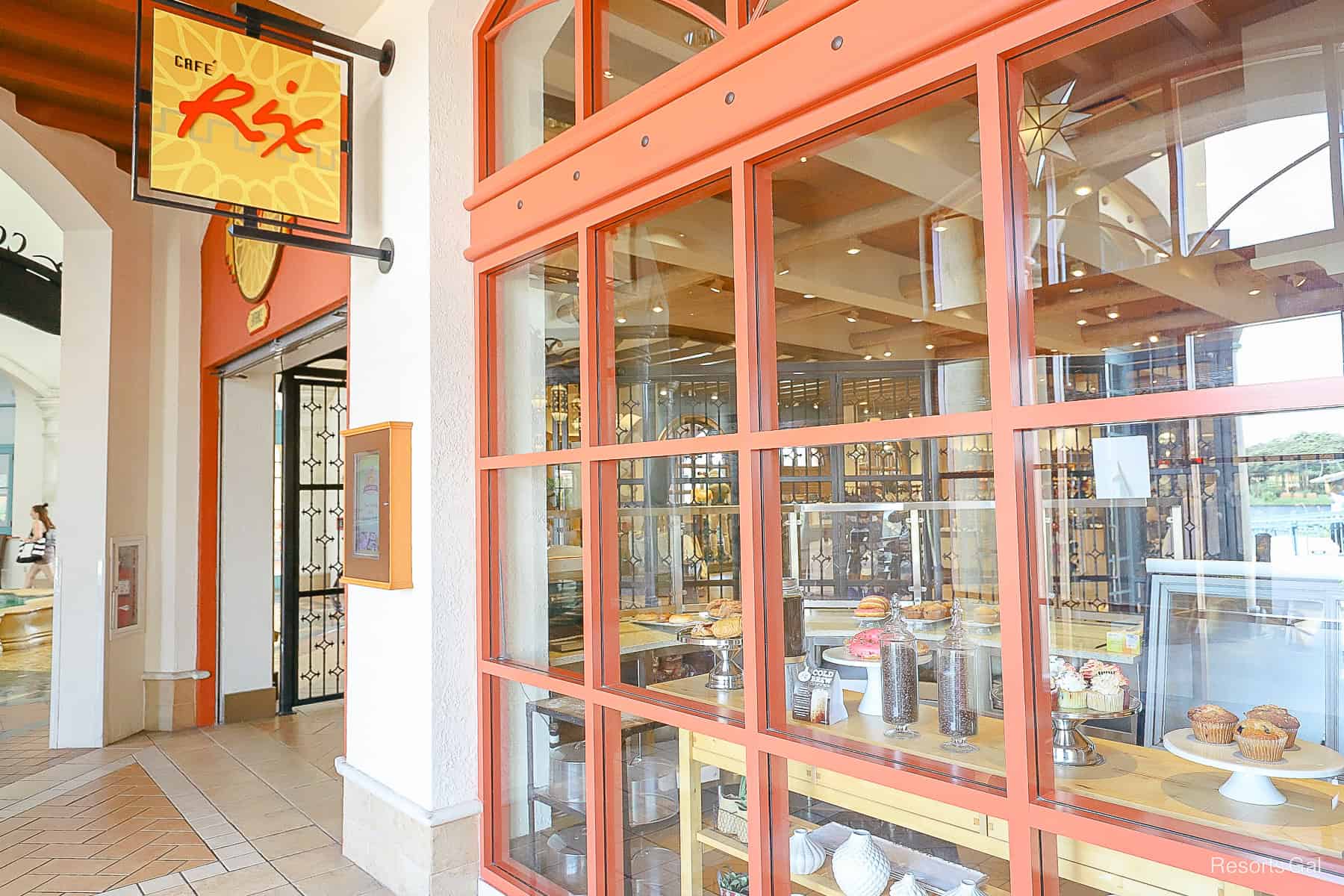 a sign that says Cafe Rix with the storefront