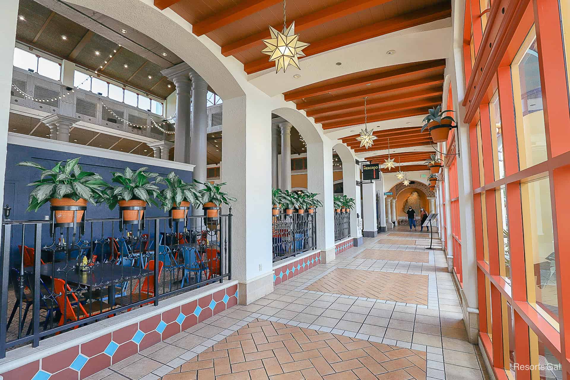 a hallway with star light fixtures and tile flooring at El Centro